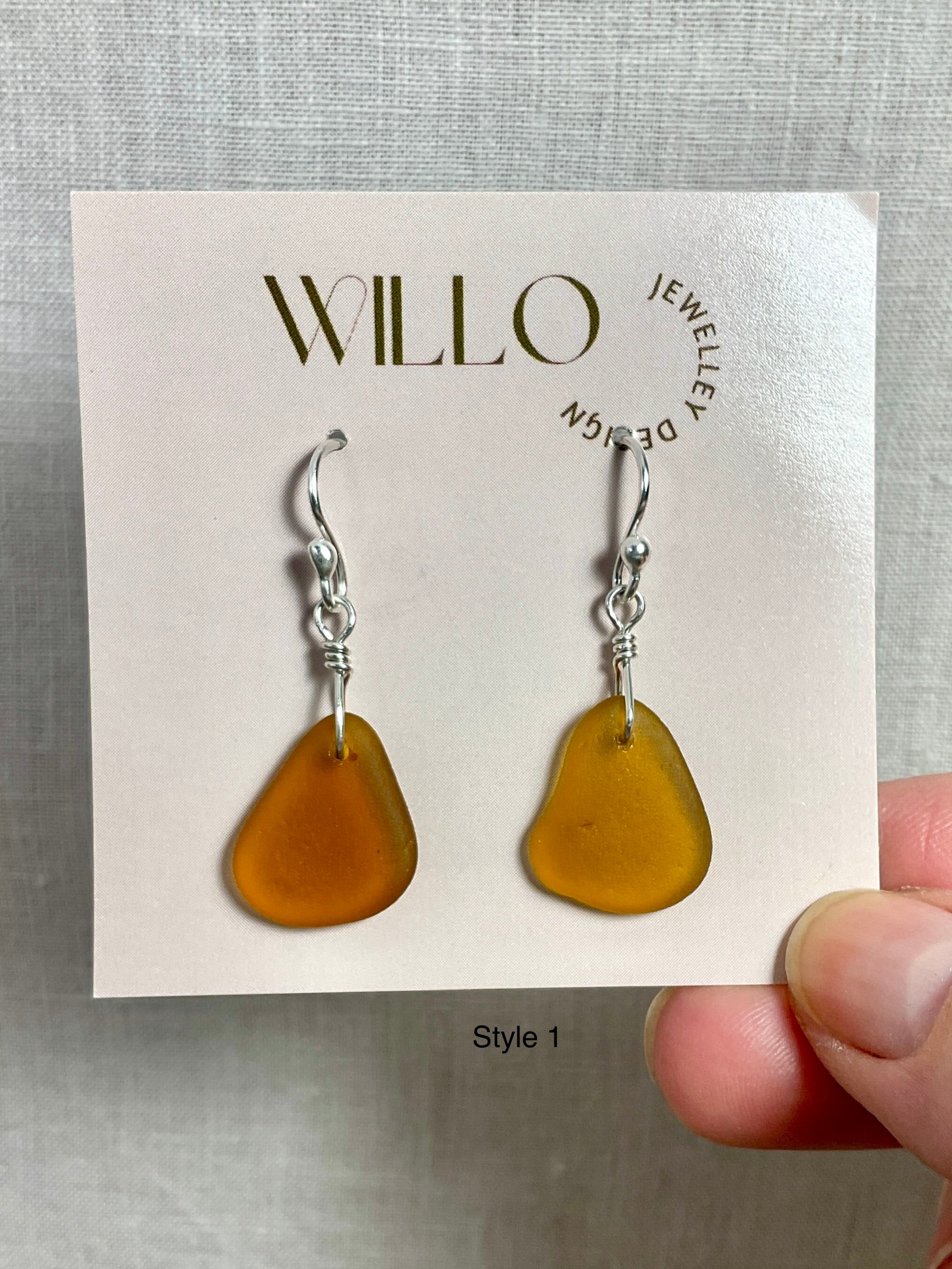 Amber sea glass earrings with argentium silver.