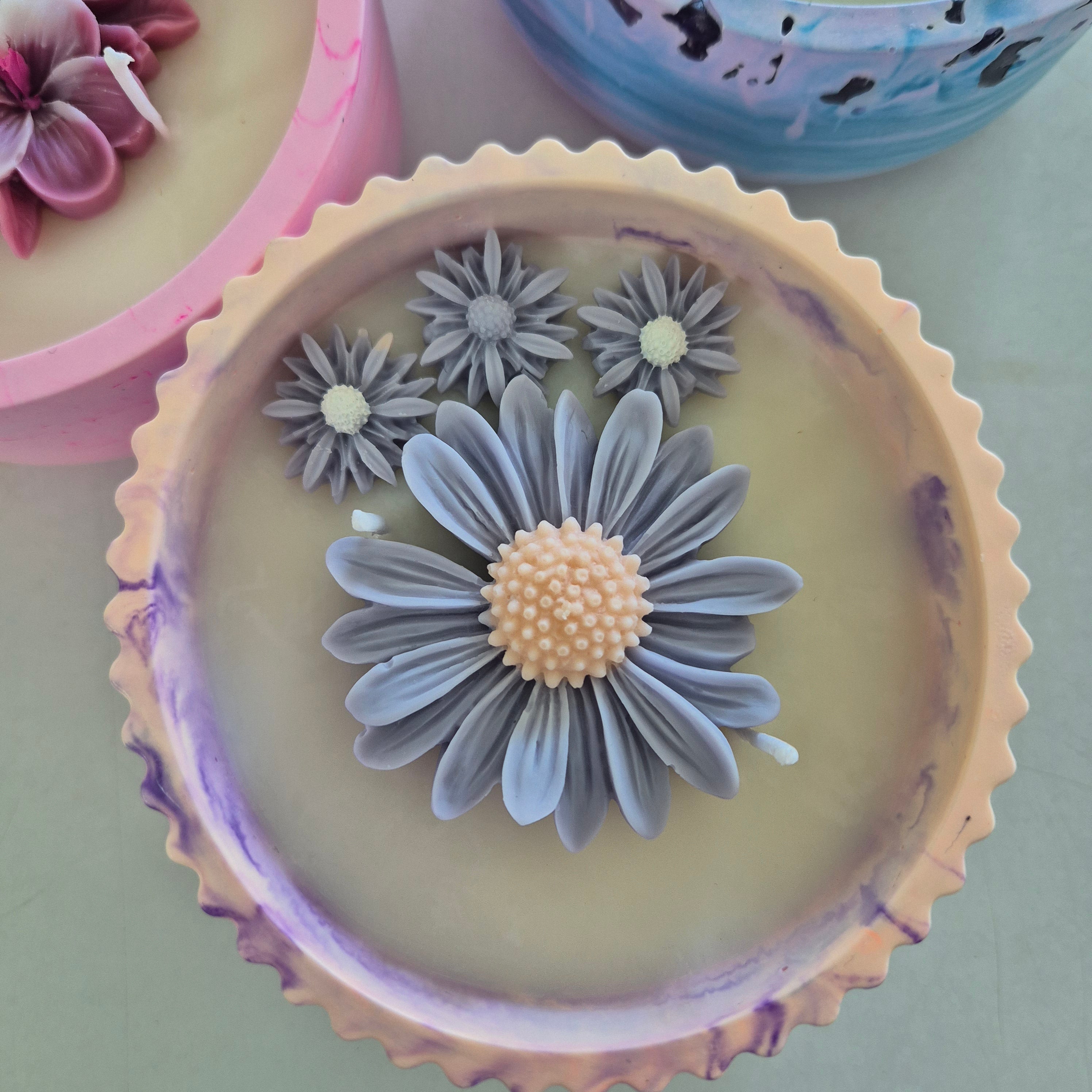 Round orange and purple concrete bowl candle with rose and lavender scent