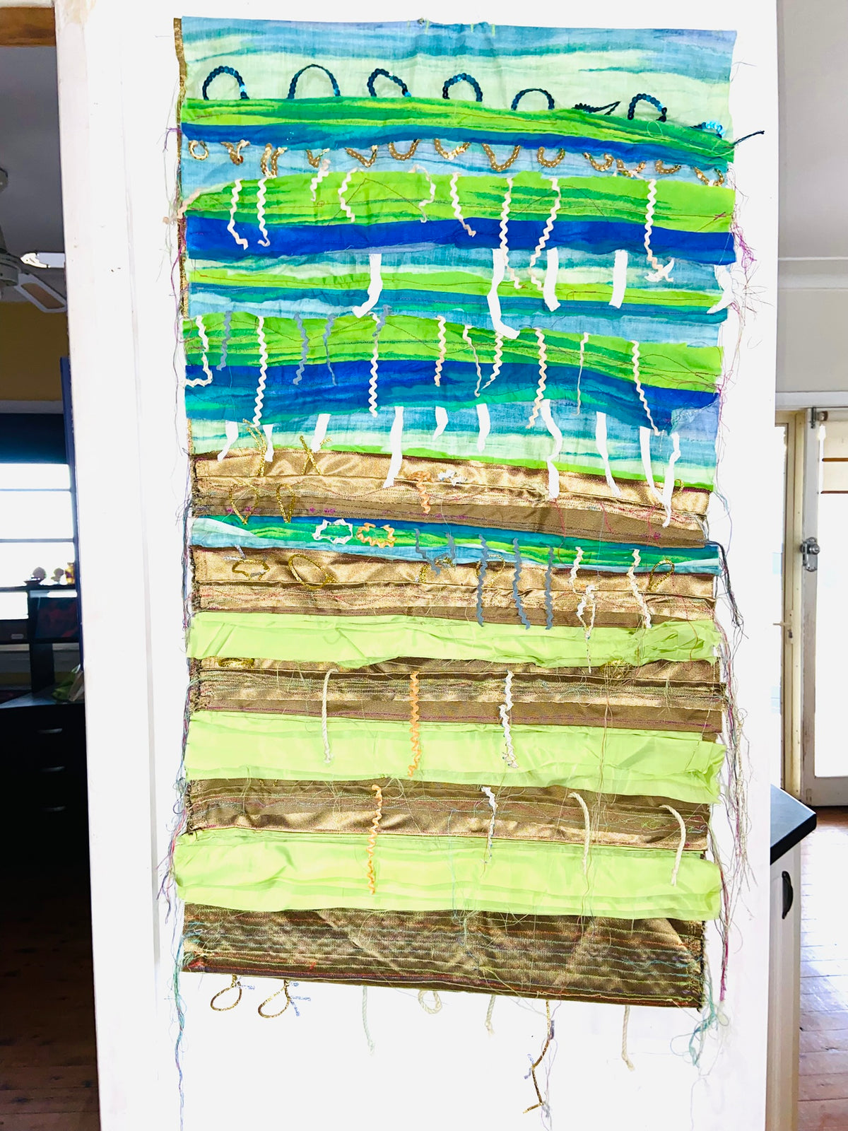 Green, Blue and Gold textile wall hanging