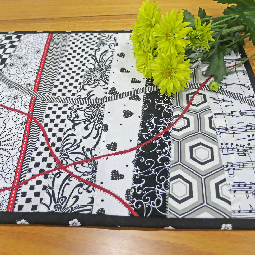 Black & white with red "rivers and tracks " table centre.