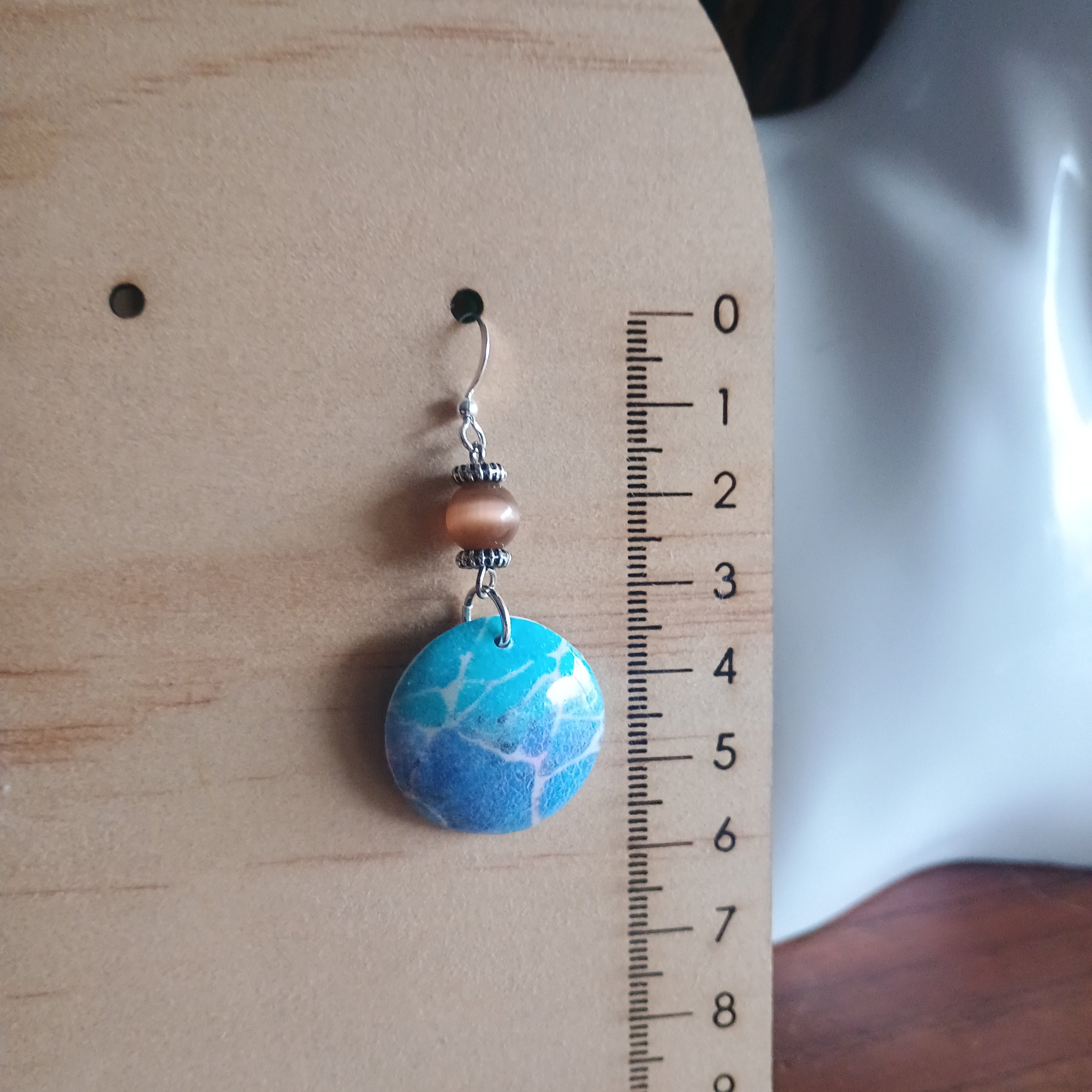 Domed blue marble print and bead polymer clay earring