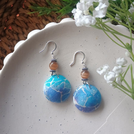 Domed blue marble print and bead polymer clay earring