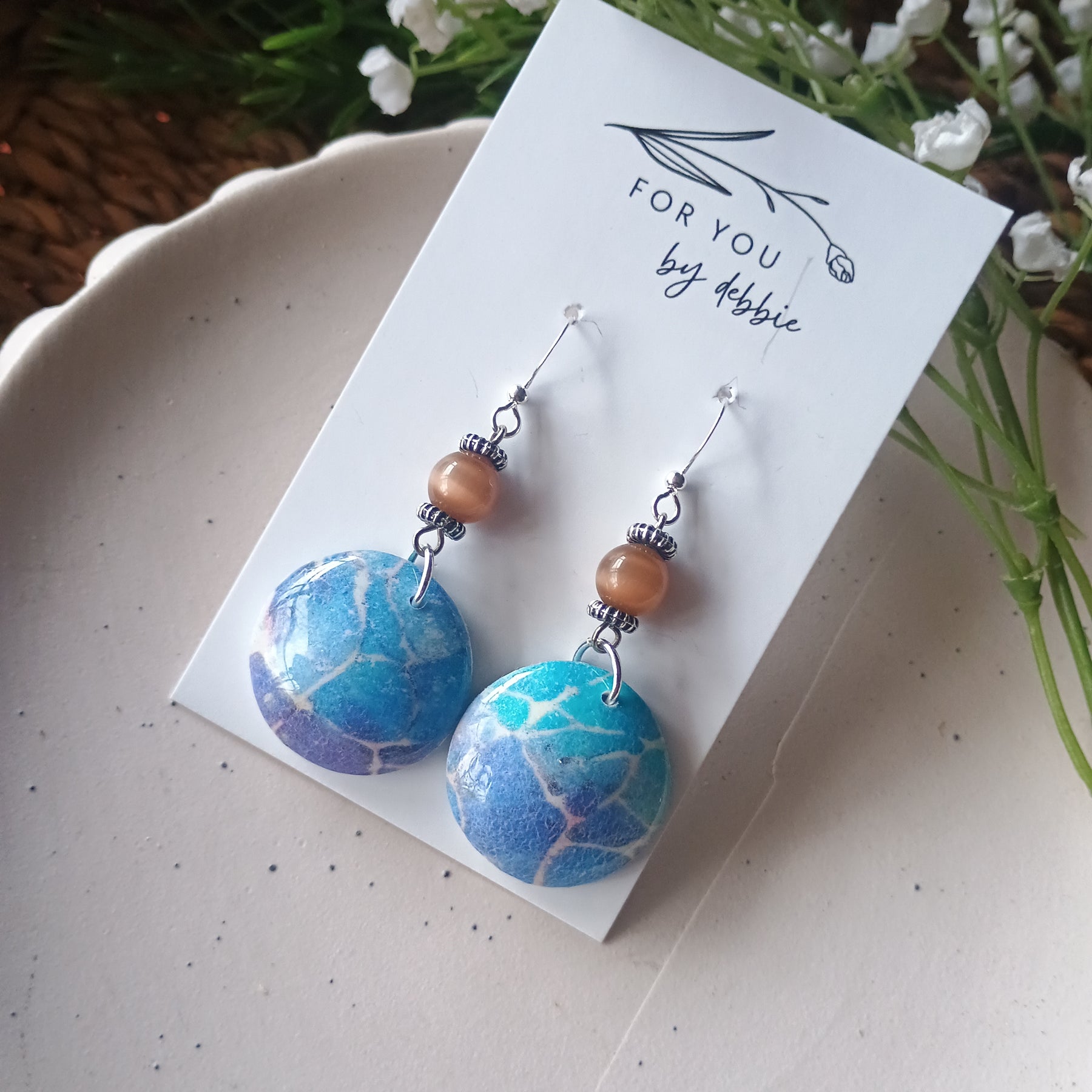 Domed blue marble print and bead polymer clay earring