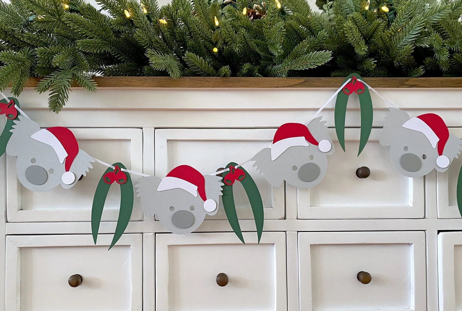 Christmas Koala Garland. Koala in Santa hat banner.