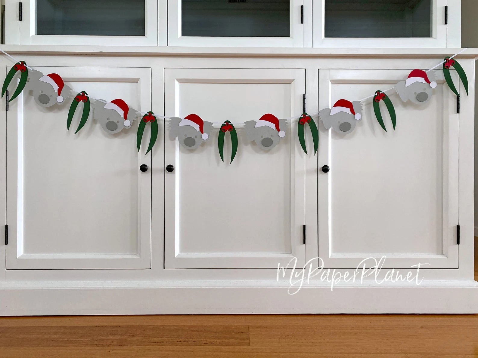 Christmas Koala Garland. Koala in Santa hat banner.