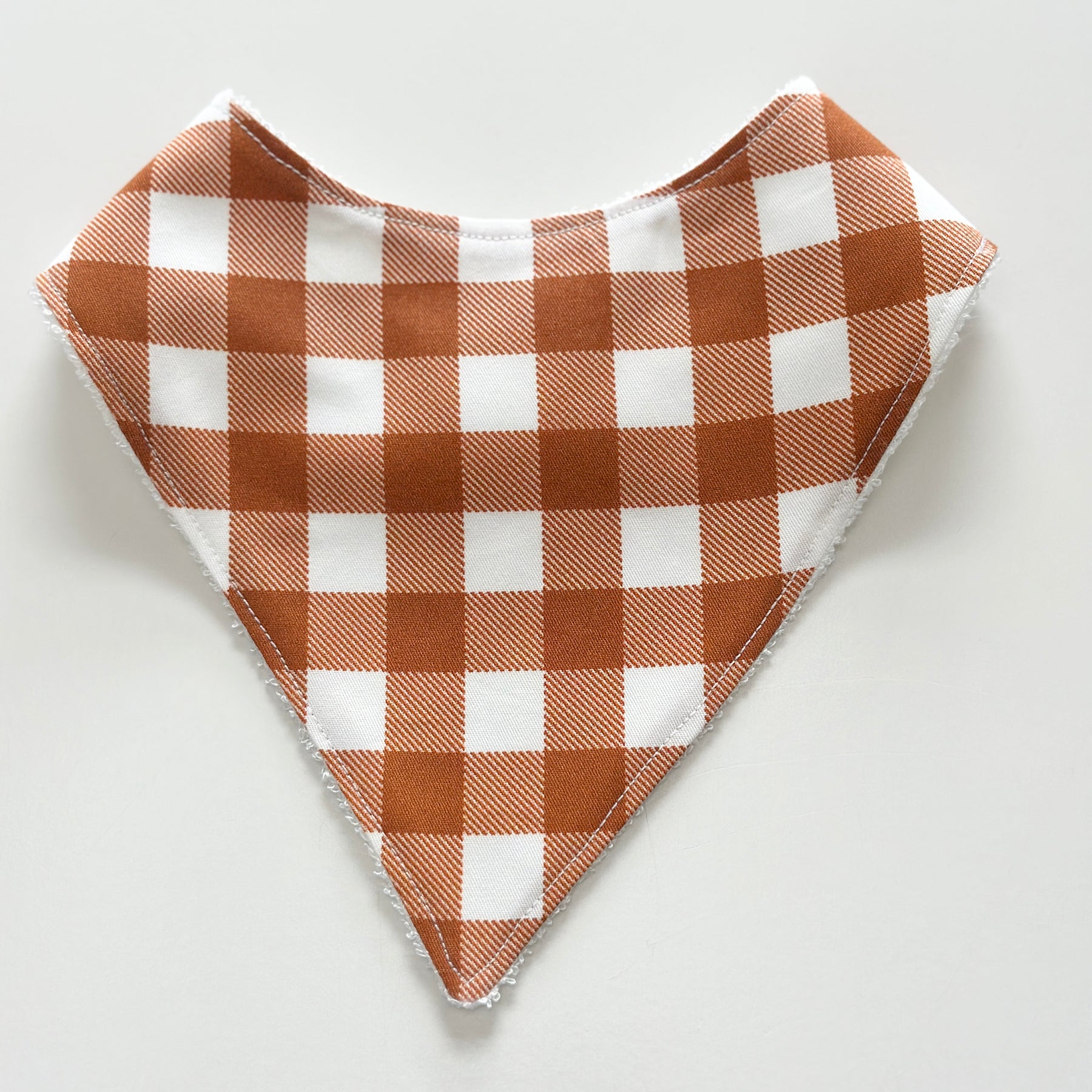 Rust gingham bandana bib