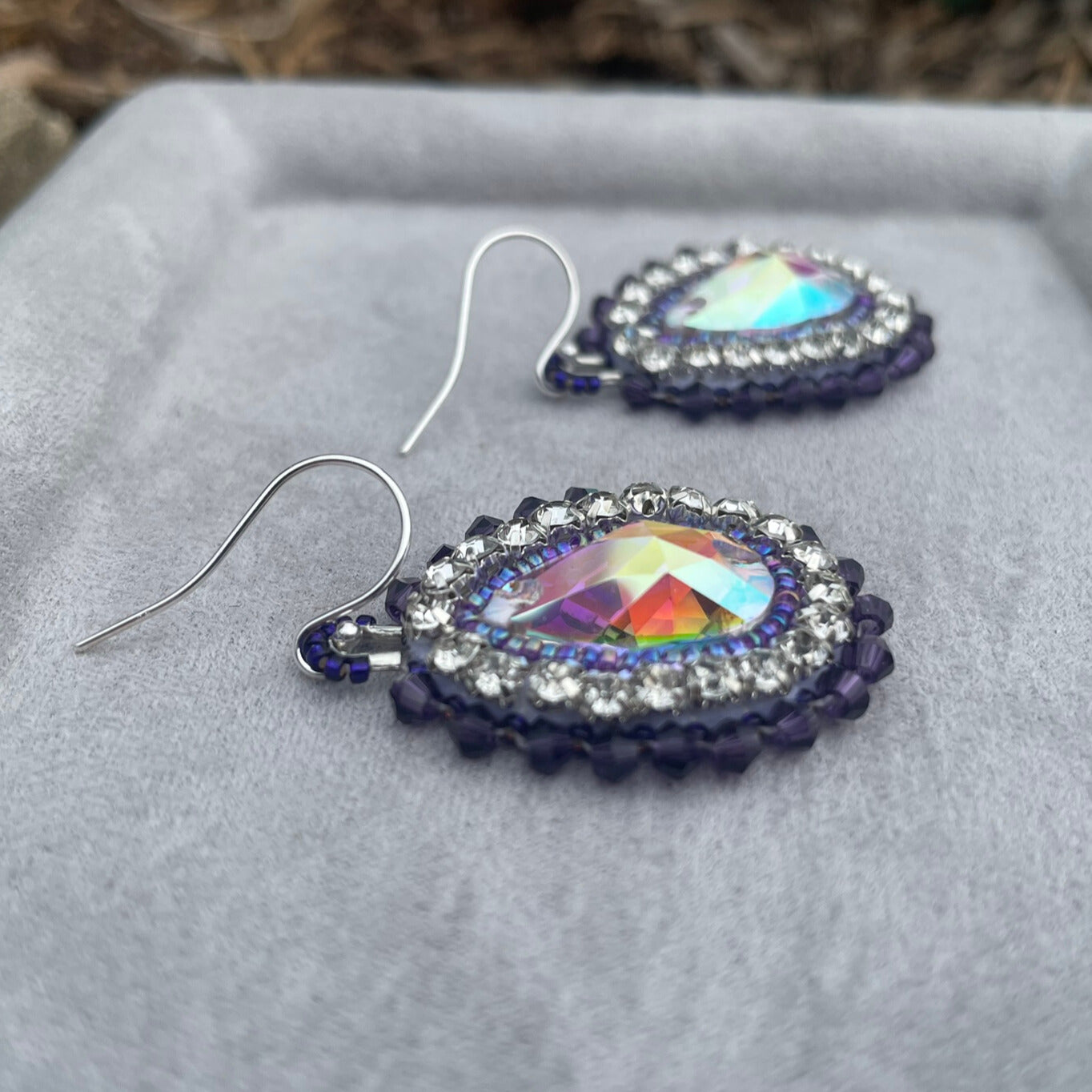 Eye-catching statement hand beaded earrings in purple and silver