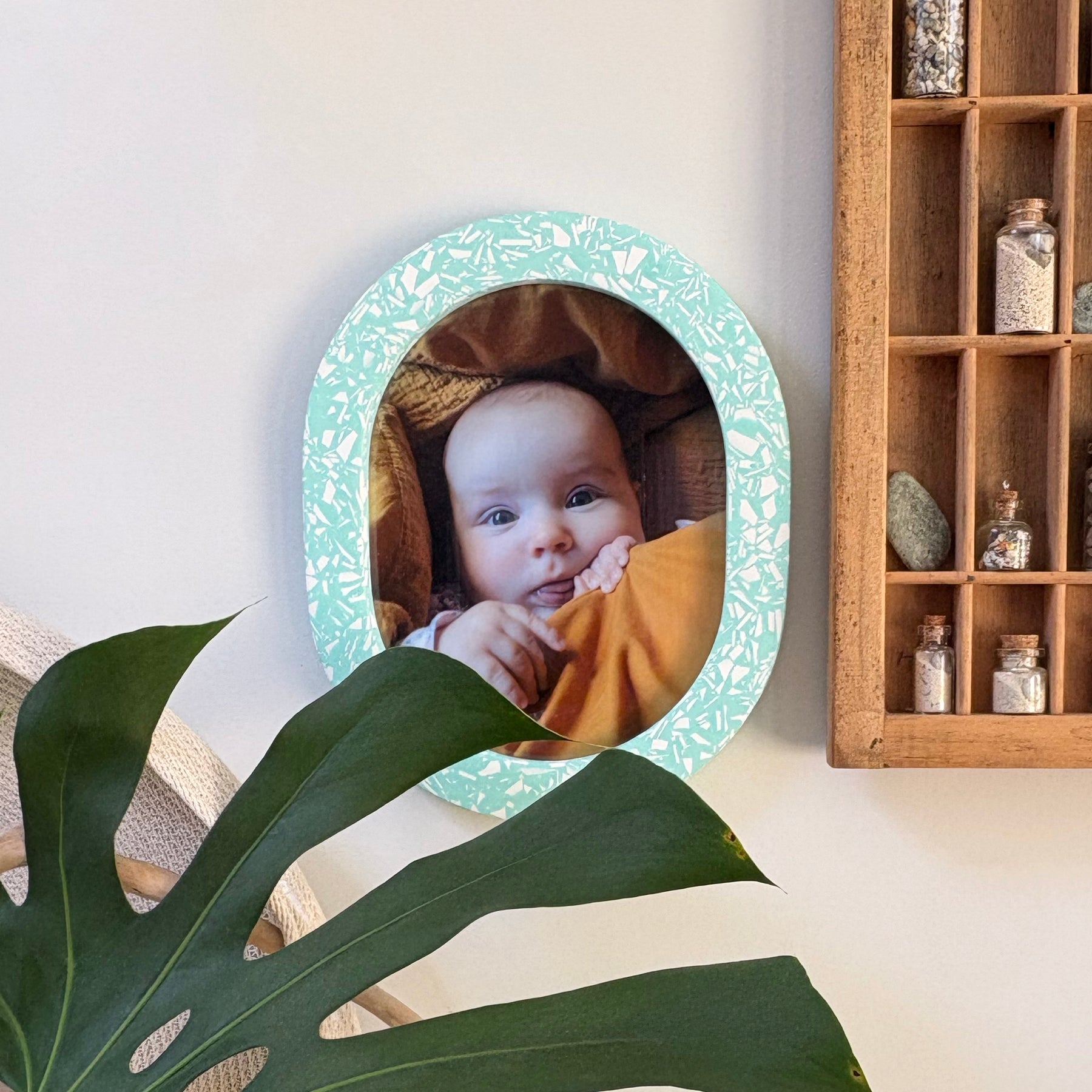 Bright turquoise & white terrazzo oval wall hanging photo frame