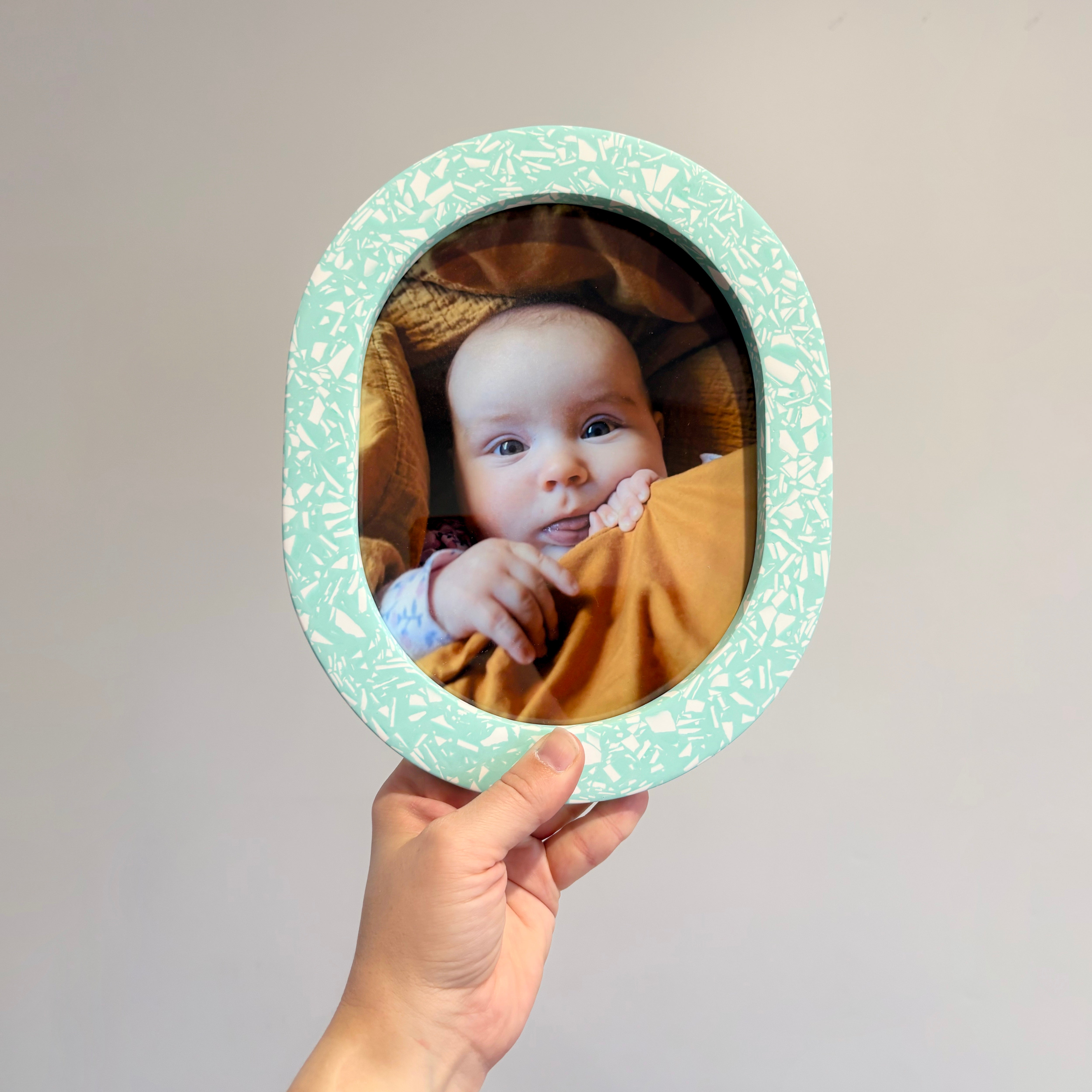 Bright turquoise & white terrazzo oval wall hanging photo frame