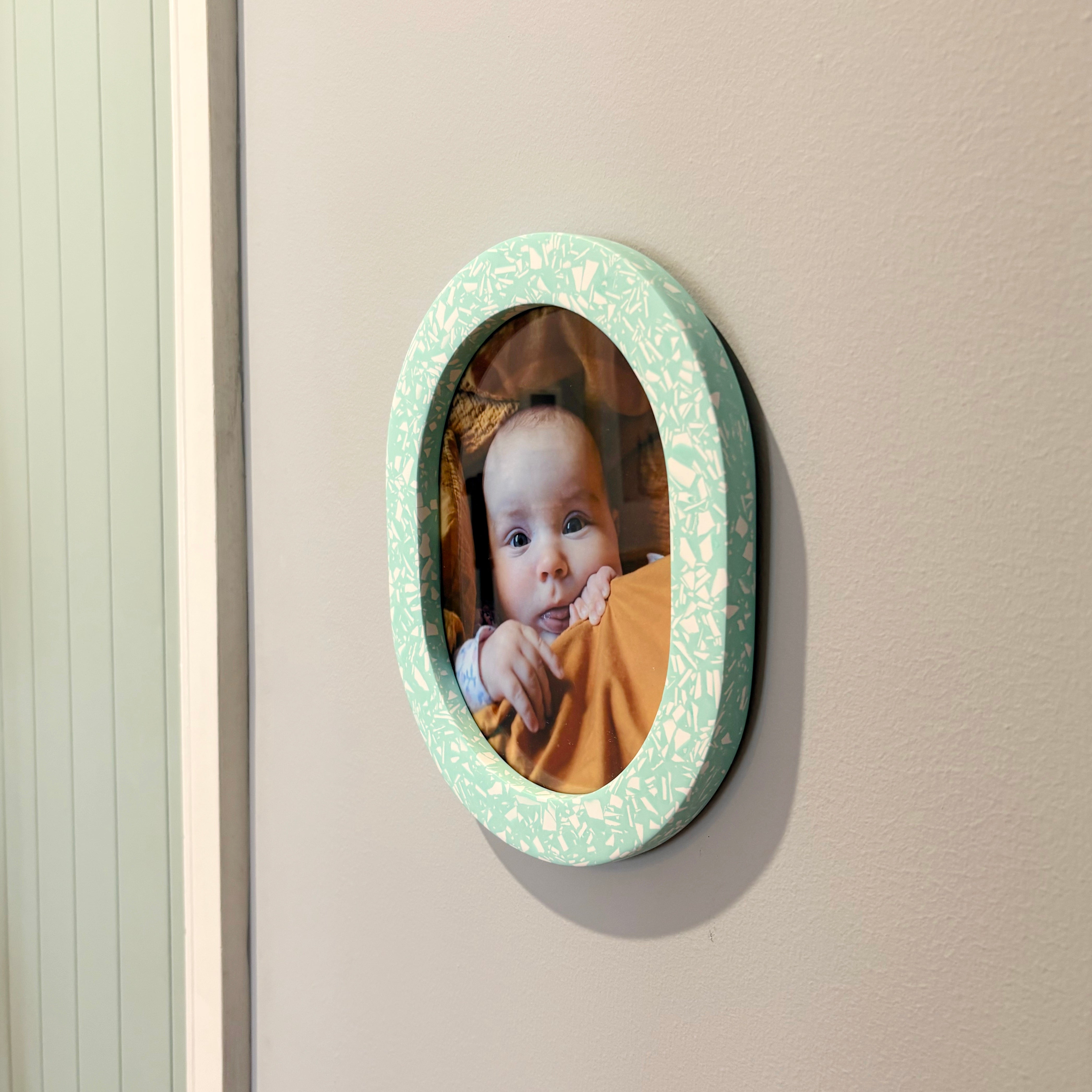 Bright turquoise & white terrazzo oval wall hanging photo frame
