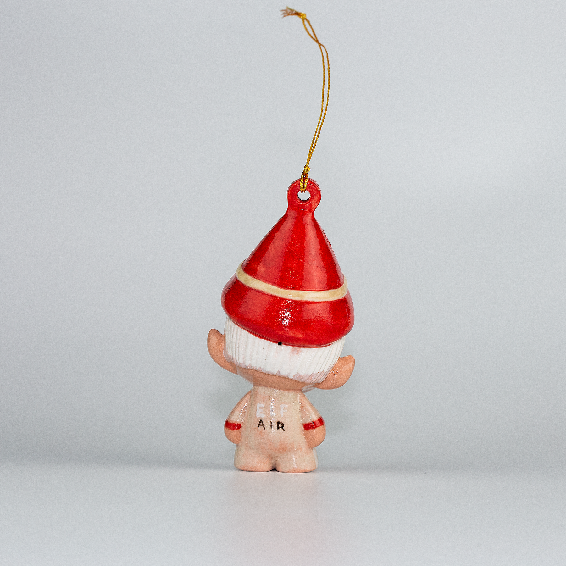 Handmade Porcelain Christmas ornament. One-of-a-kind. Zac, the sleigh mechanic Elf.