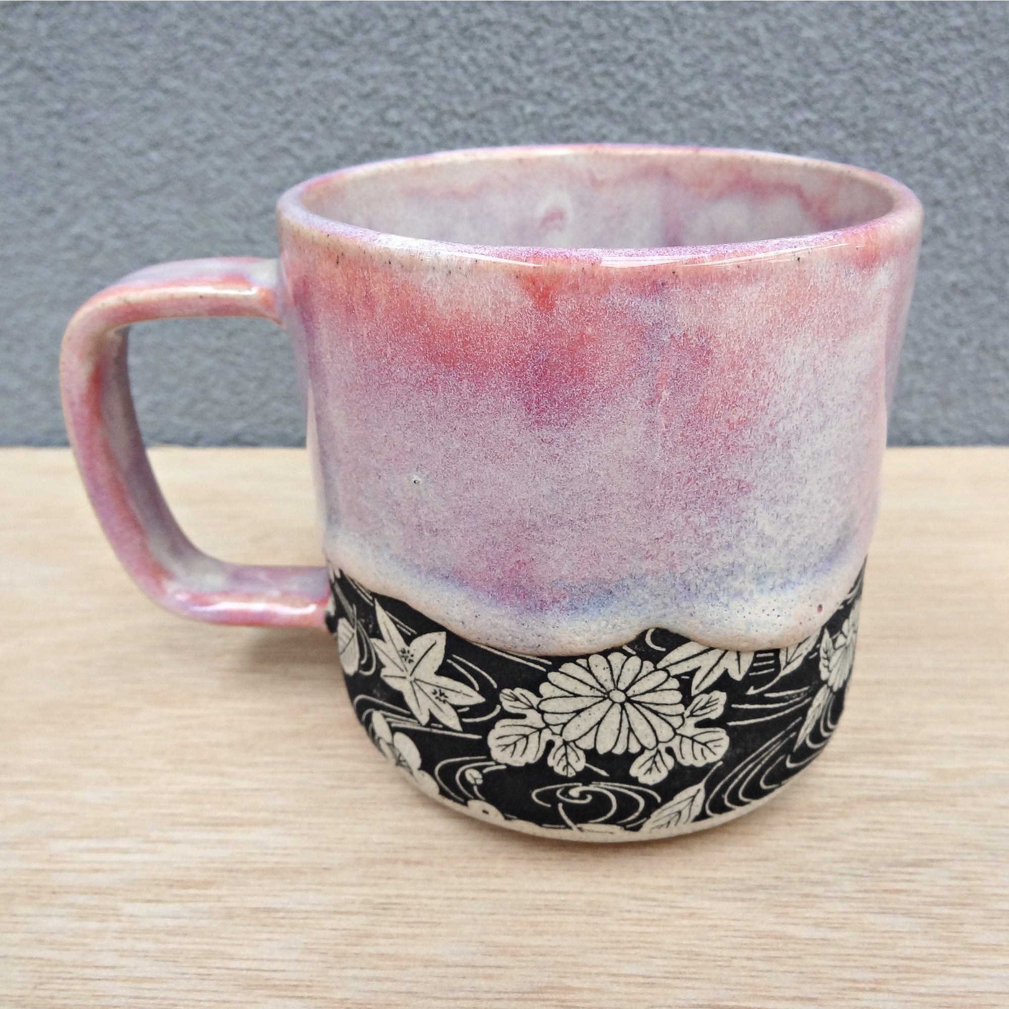 Handmade pink ceramic coffee or tea mug. Drippy soft pink glaze.