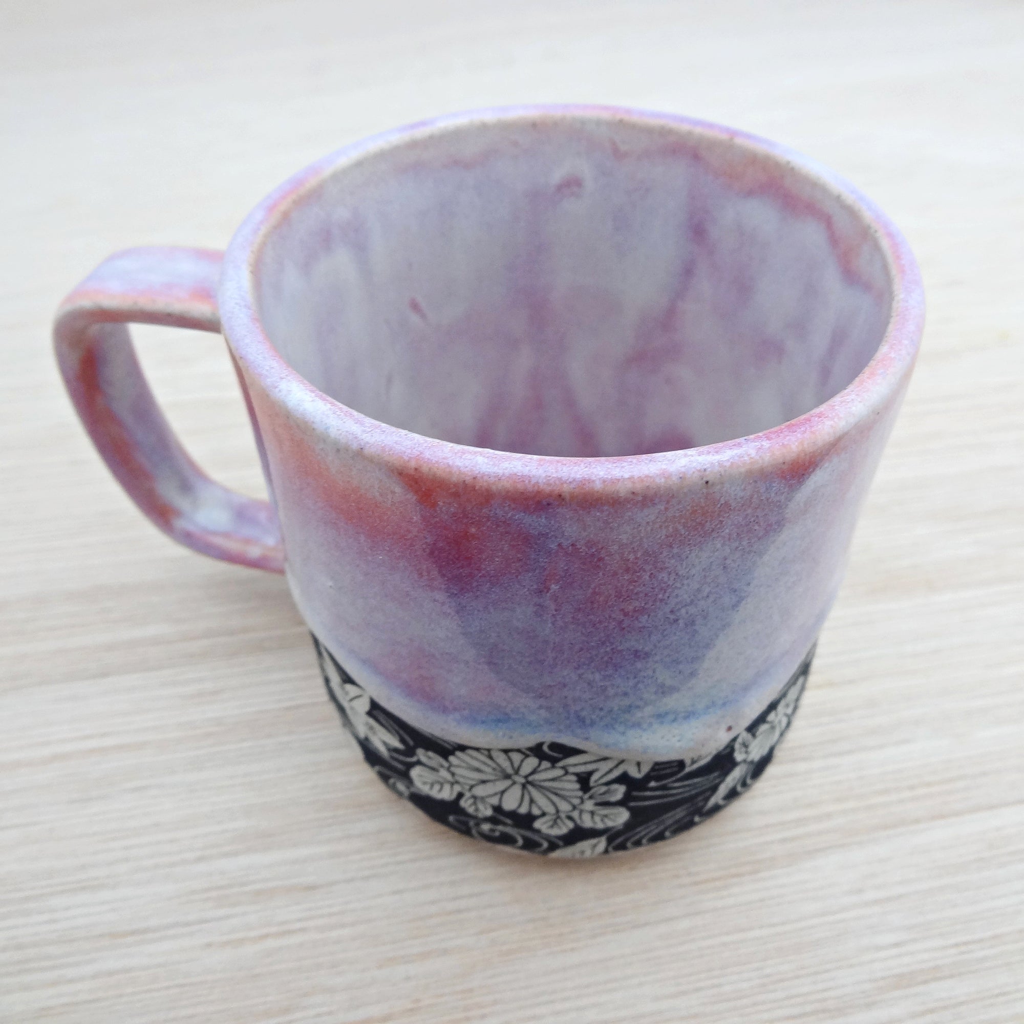 Handmade pink ceramic coffee or tea mug. Drippy soft pink glaze.