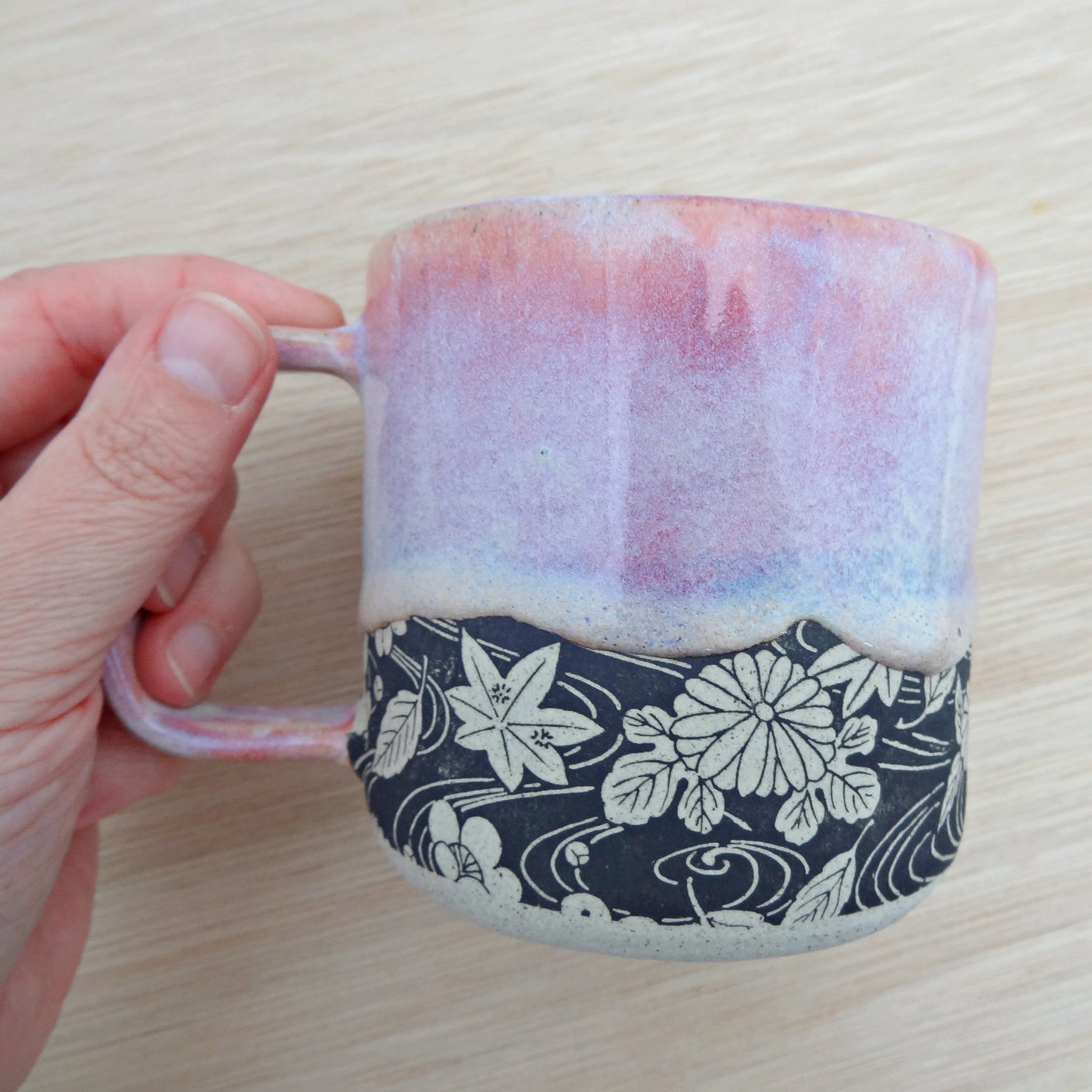 Handmade pink ceramic coffee or tea mug. Drippy soft pink glaze.