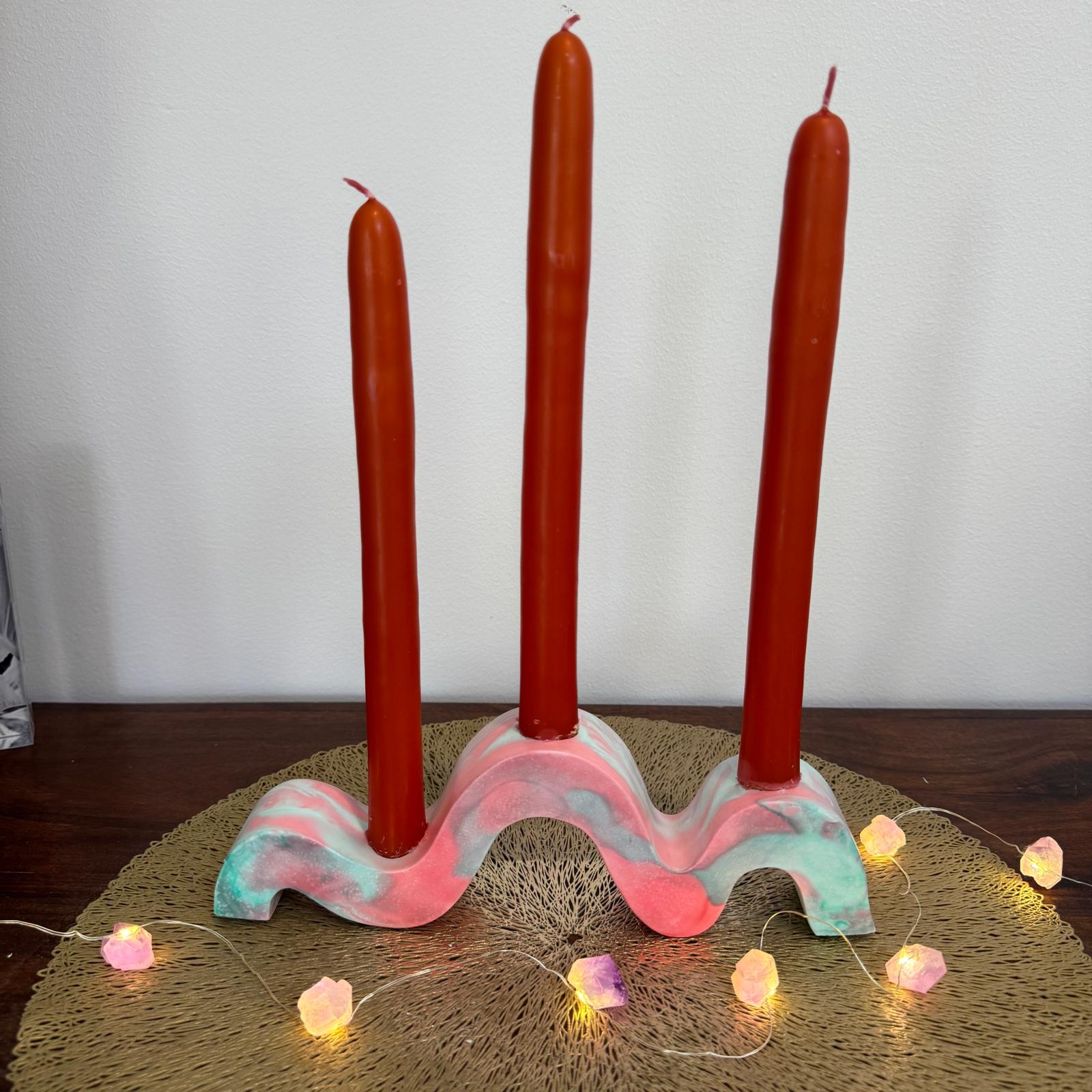 Red and green and gold wavy concrete holder for taper candles