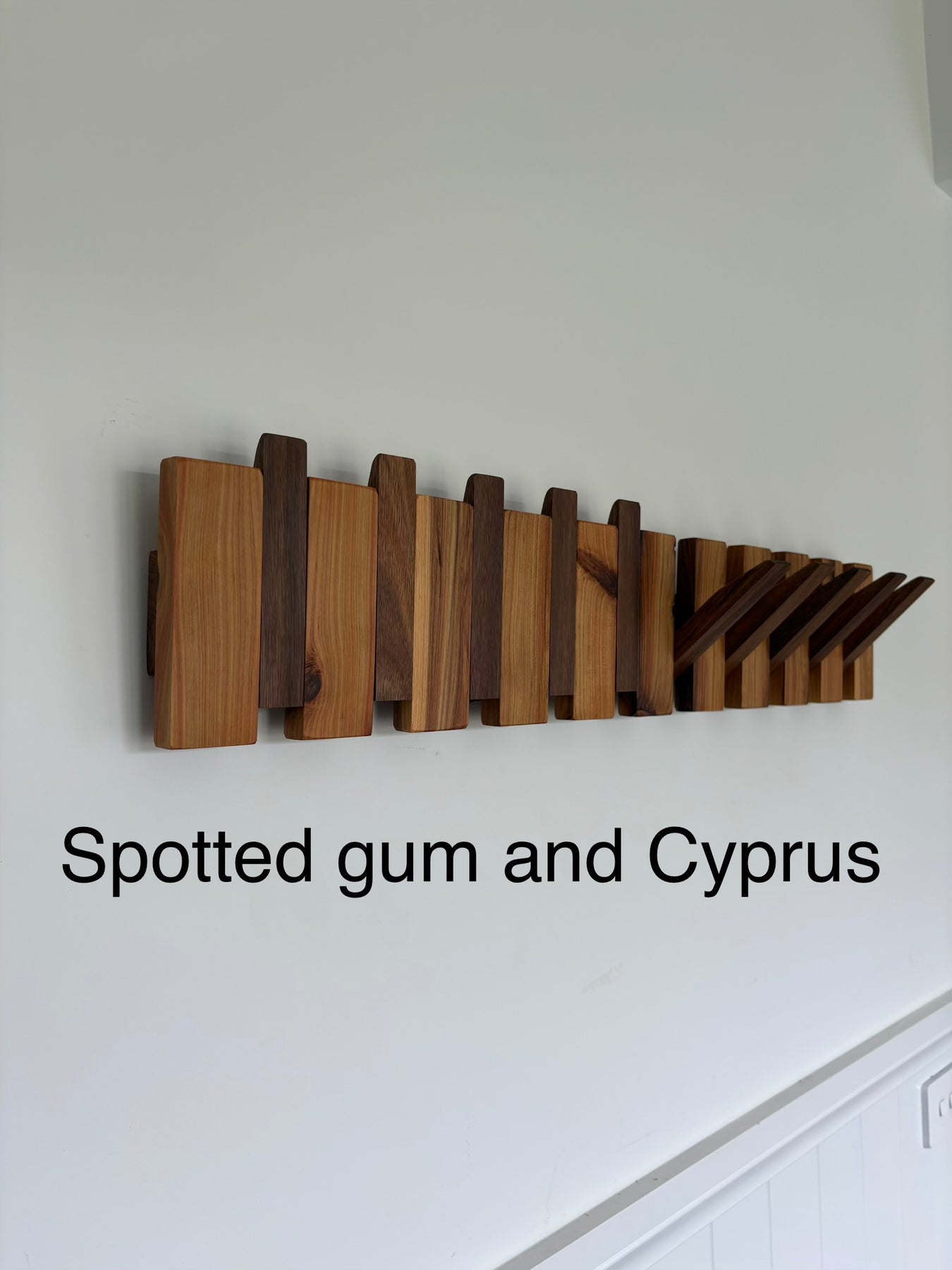 Two tone piano style coatrack