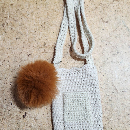 Crochet cellphone bag with brown pom pom