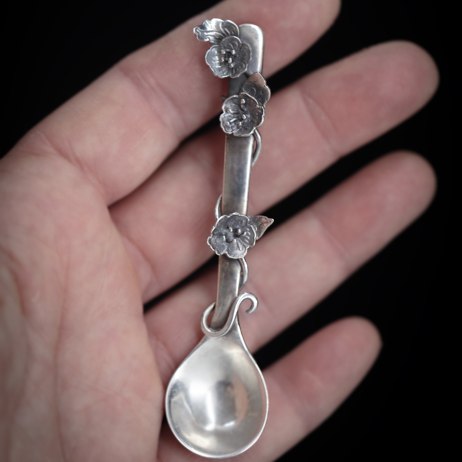 Sterling silver salt spoon with flowers