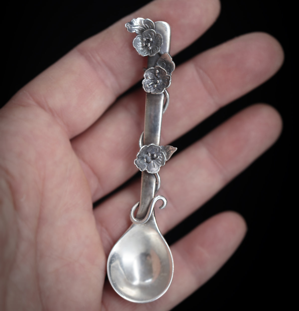 Sterling silver salt spoon with flowers