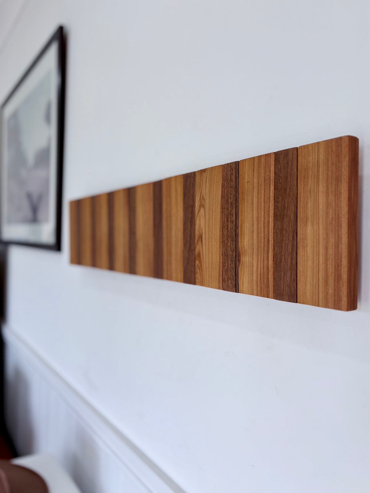 Two tone spotted gum and cypress horizon line piano style coatrack