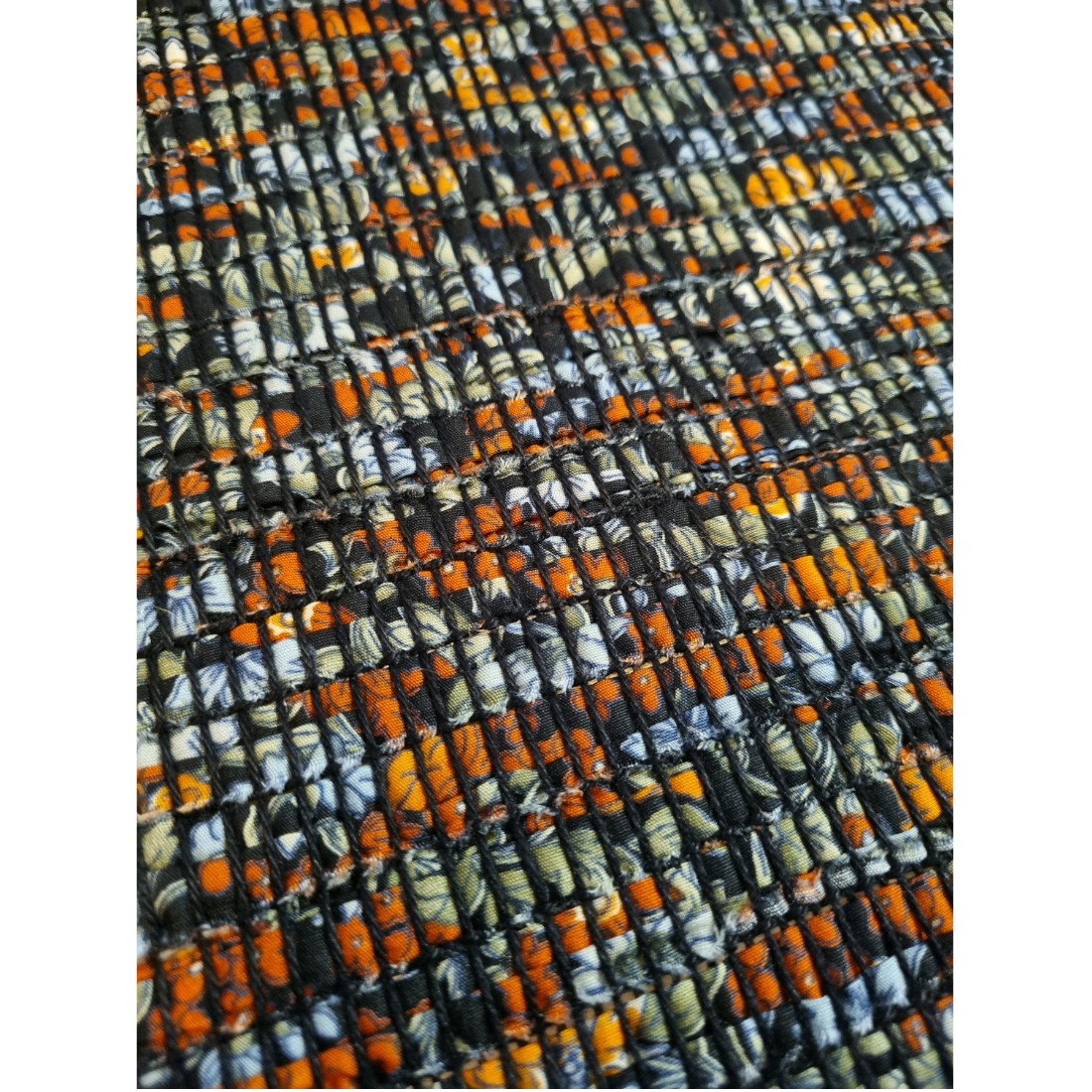 Woven black and orange floral tablerunner