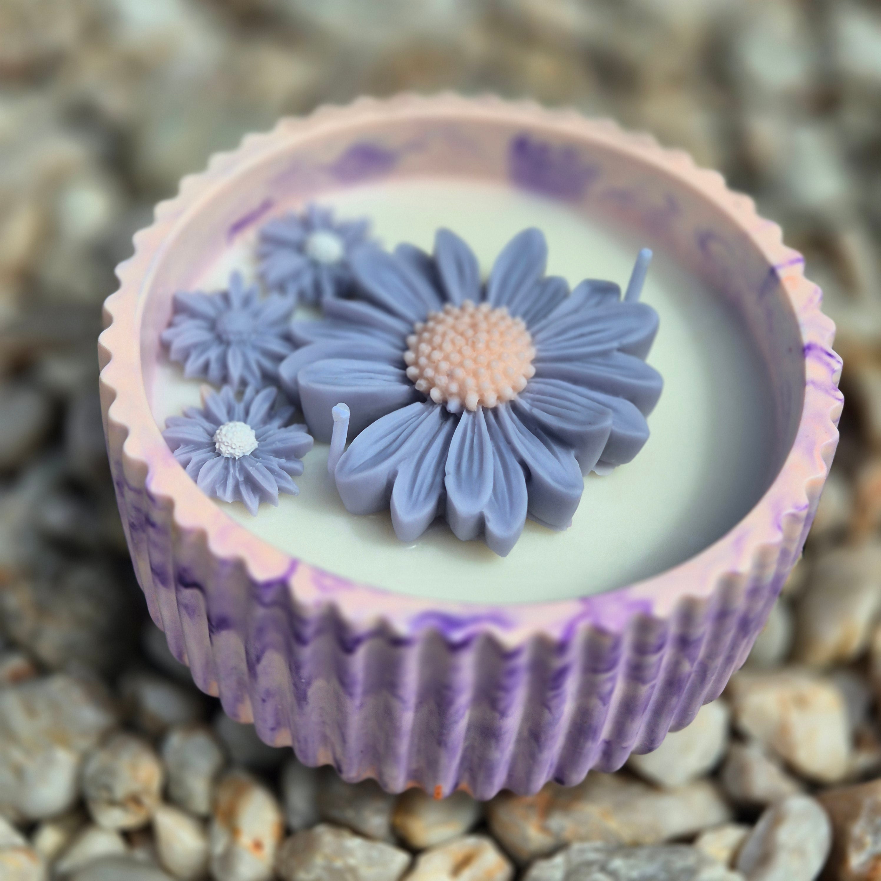 Round orange and purple concrete bowl candle with rose and lavender scent