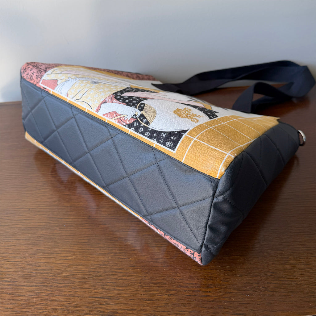 Tote-style handbag with side pockets and main zip