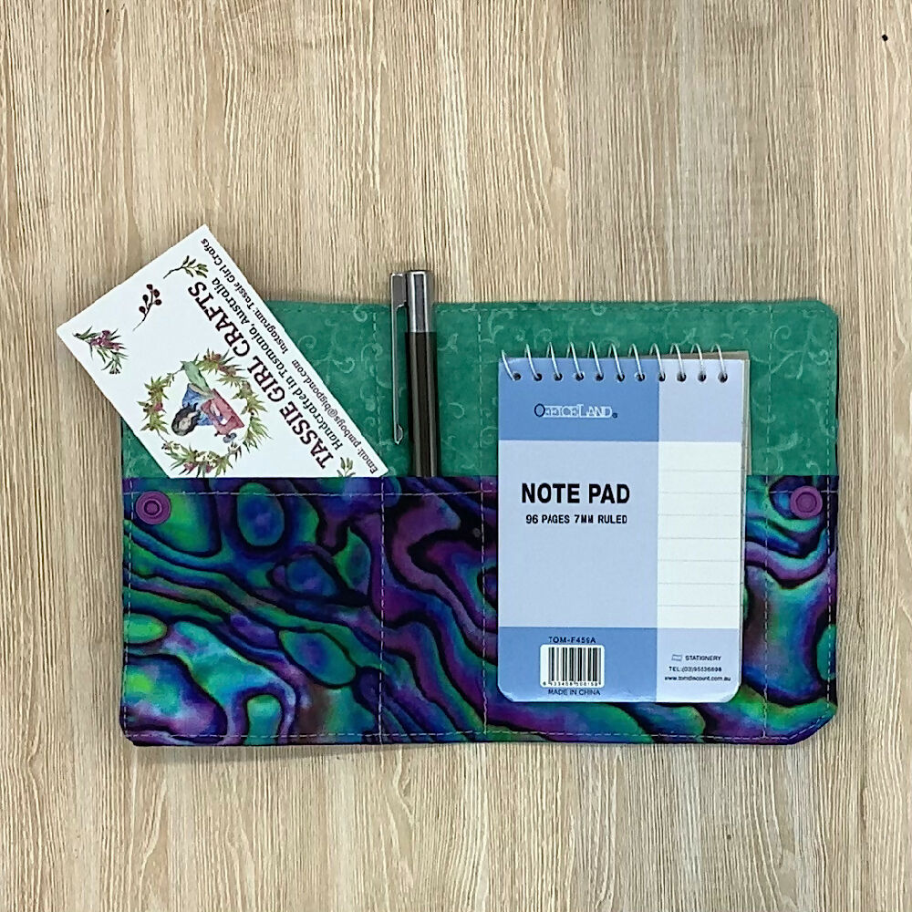 Paua shell refillable fabric pocket notepad cover with snap closure. Incl. book and pen.