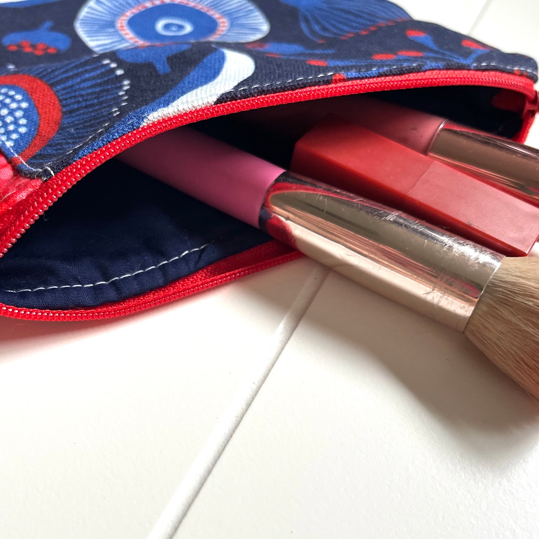 Red and blue gum blossom purse