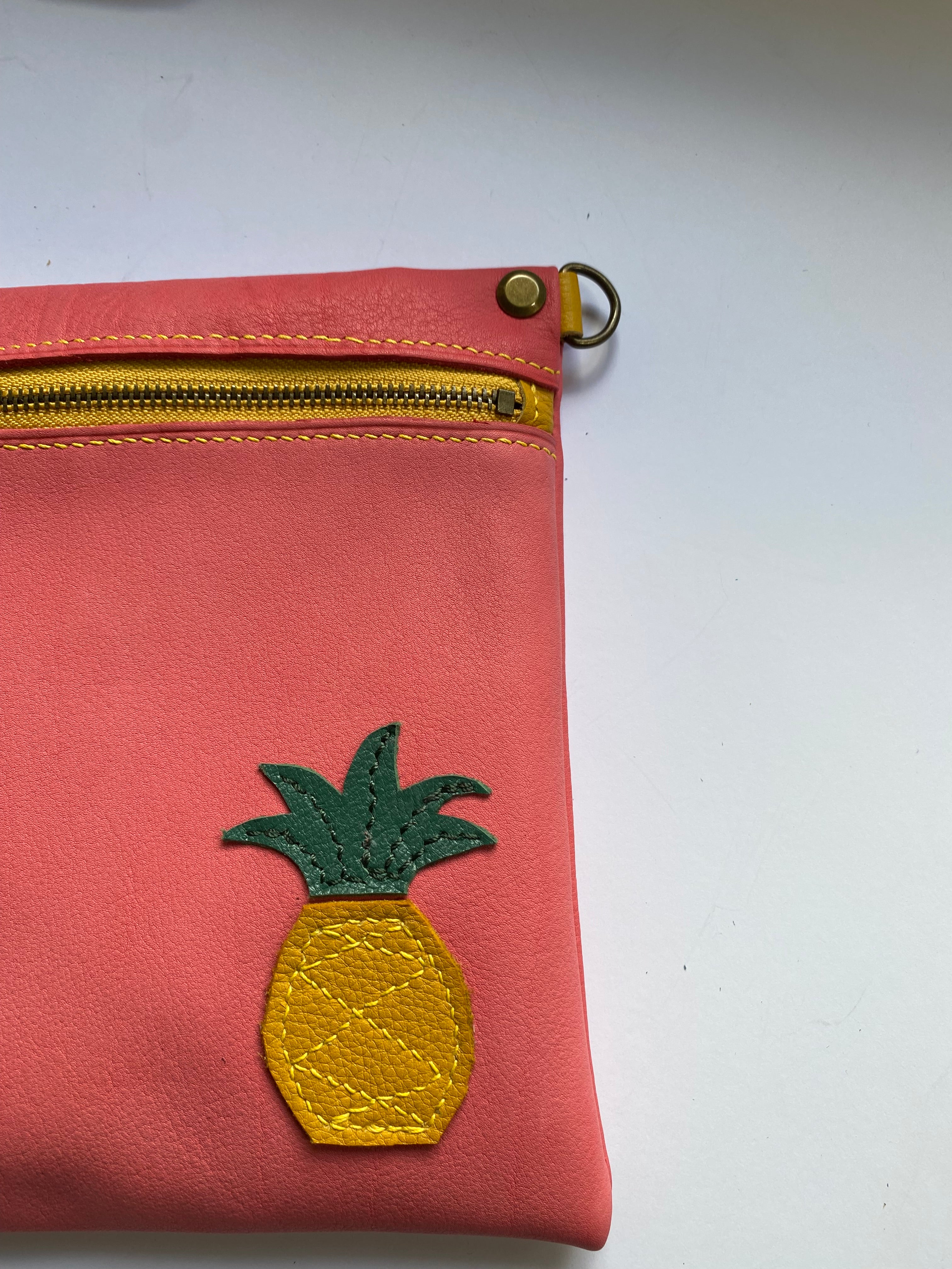 Leather crossbody bag with pineapple motif