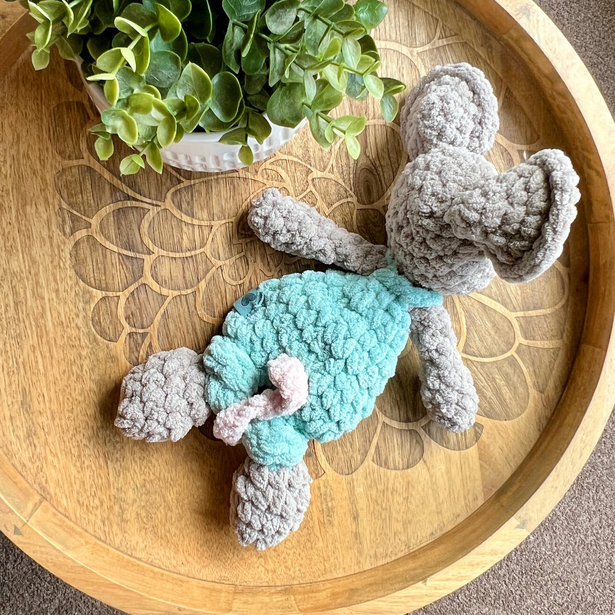 Handmade crochet Mini Mouse modern lovey in overalls with knotted legs.