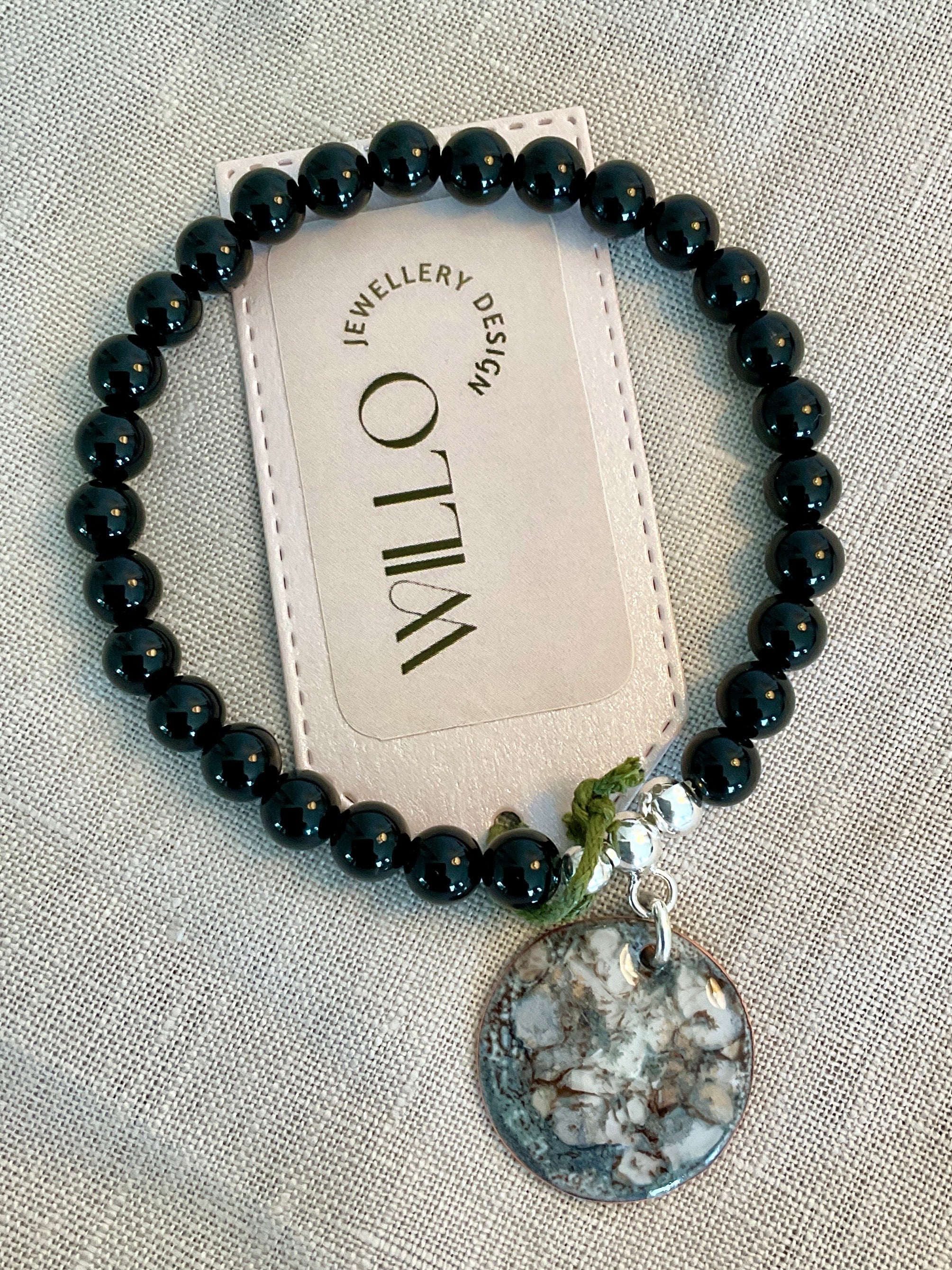 Black Onyx beaded bracelet with enamel charm