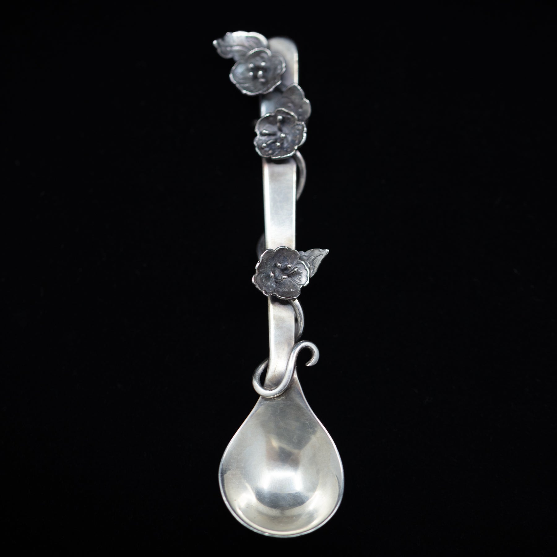 Sterling silver salt spoon with flowers