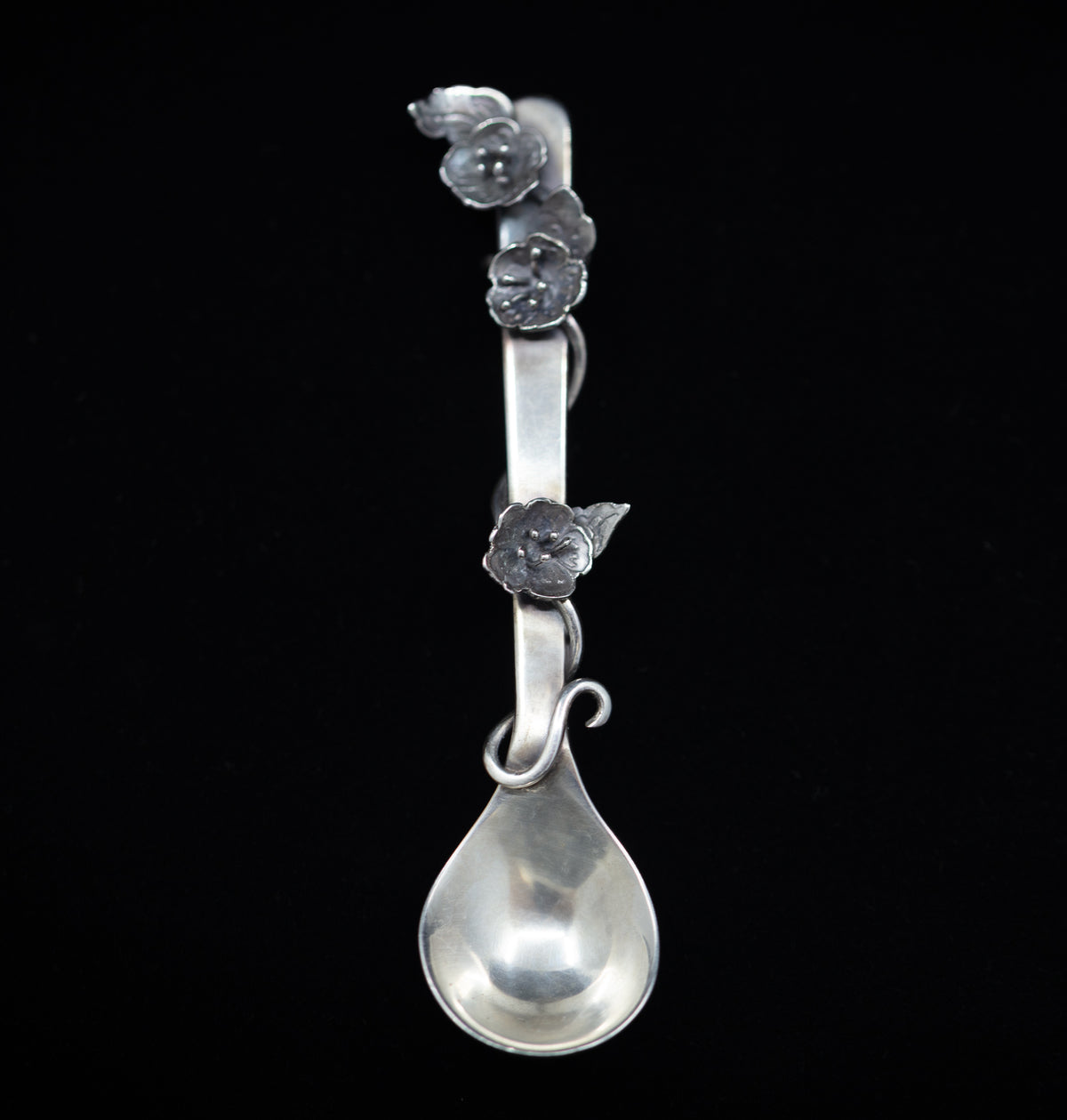 Sterling silver salt spoon with flowers