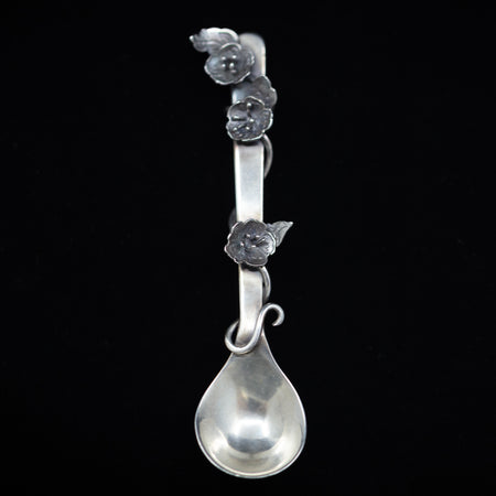 Sterling silver salt spoon with flowers