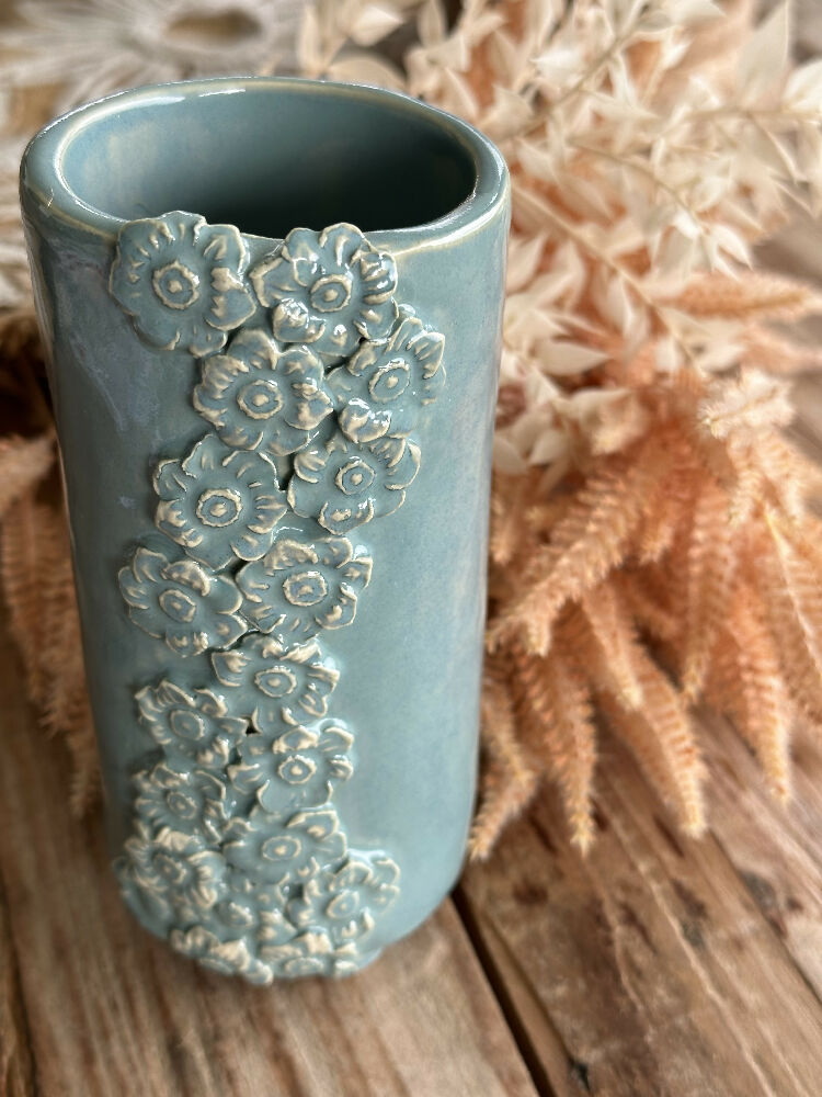 Vase with trailling flower design