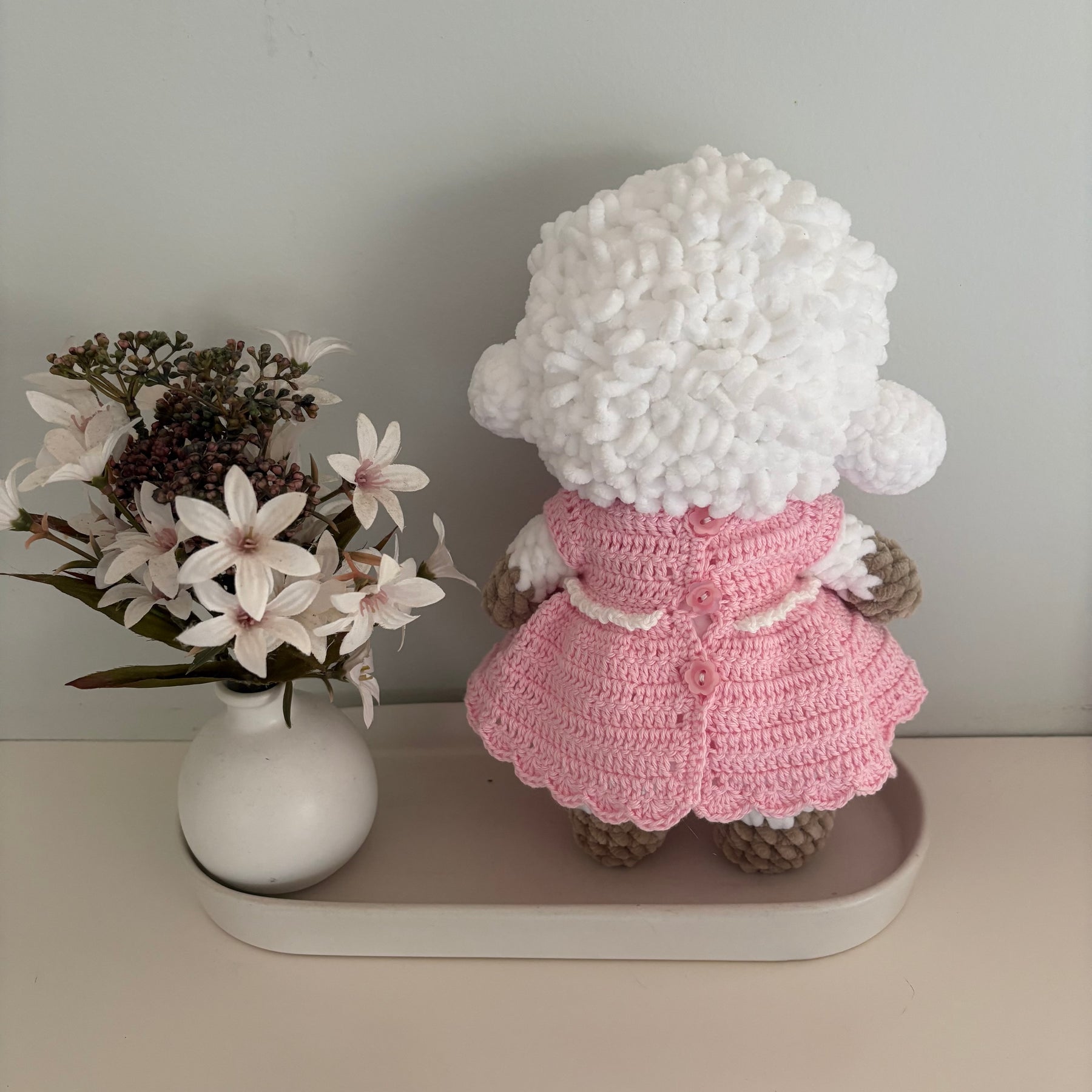 Crochet lamb in a pink dress