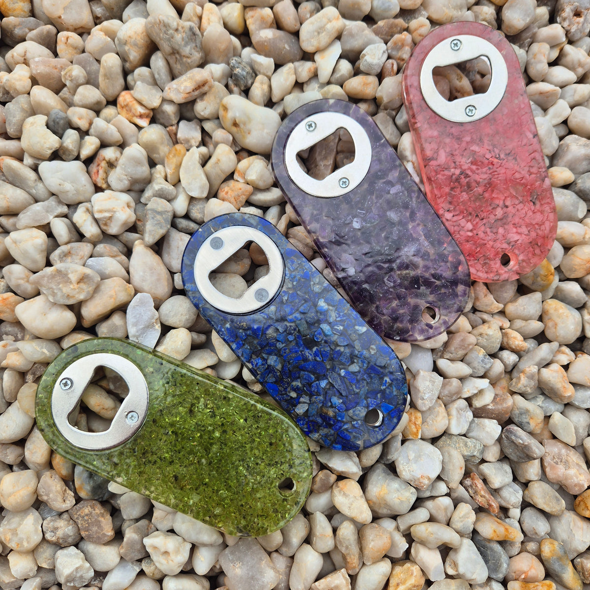 Resin bottle opener with inlaid rose quartz stones