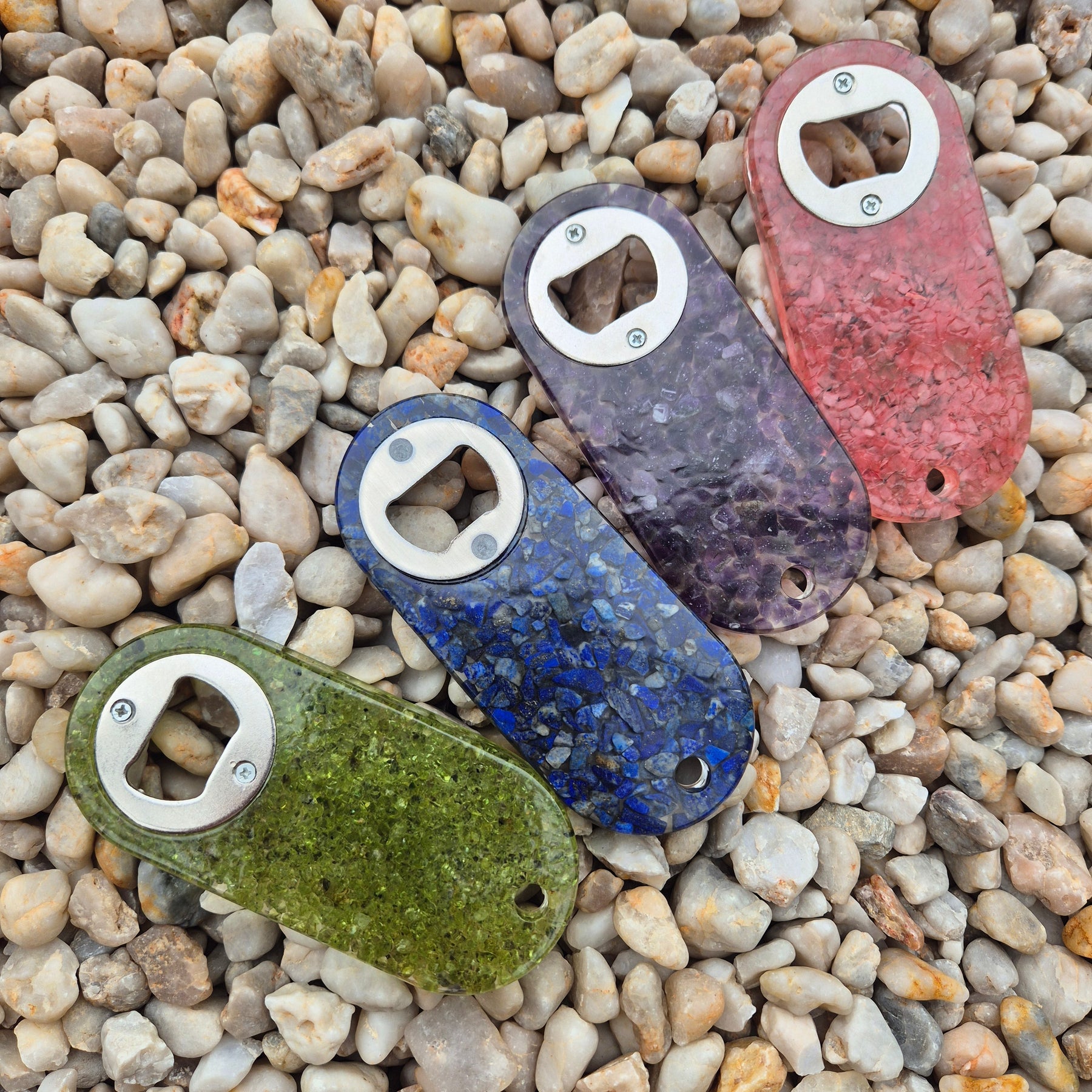 Resin bottle opener with inlaid peridot stones