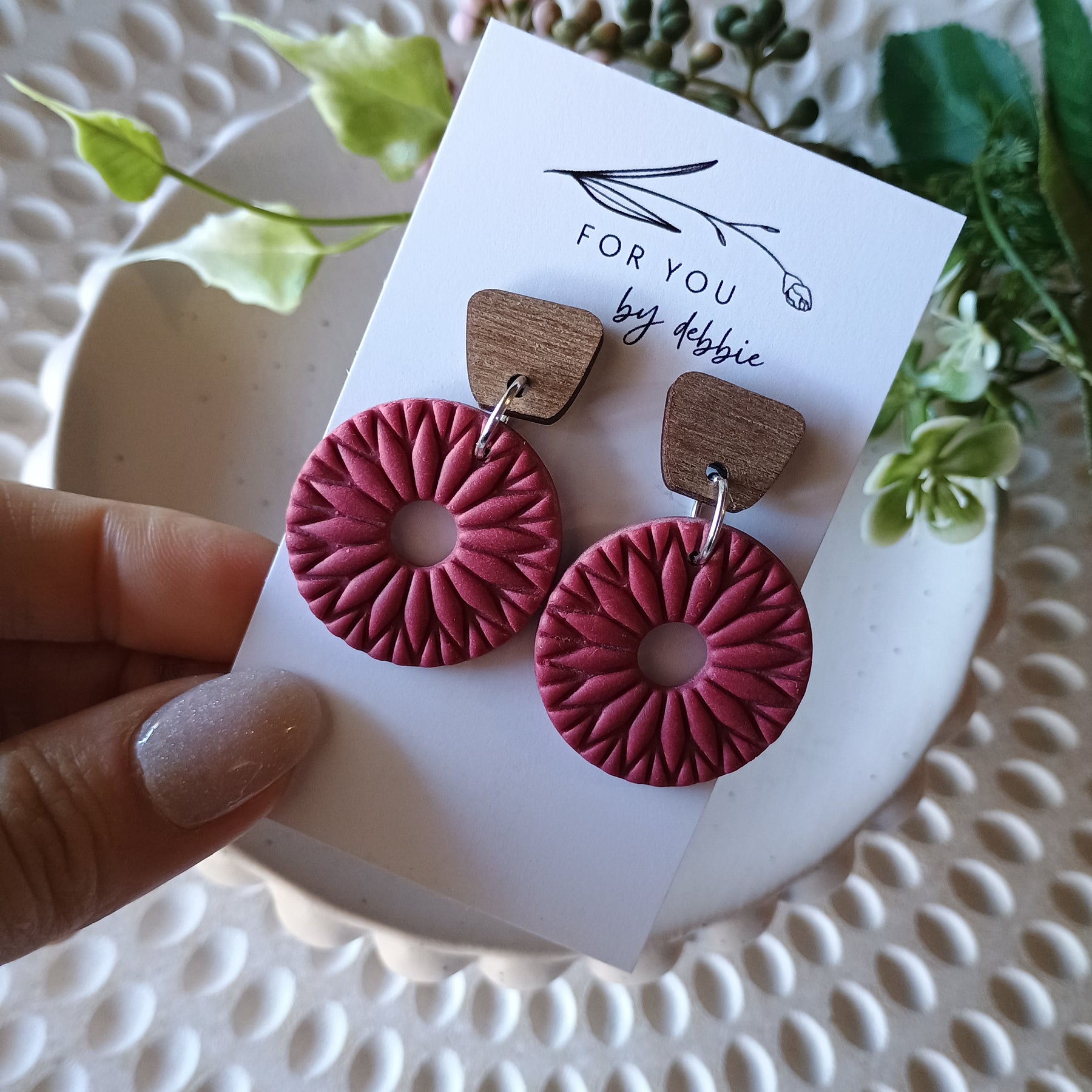 Red embossed circle earrings with natural wood stud