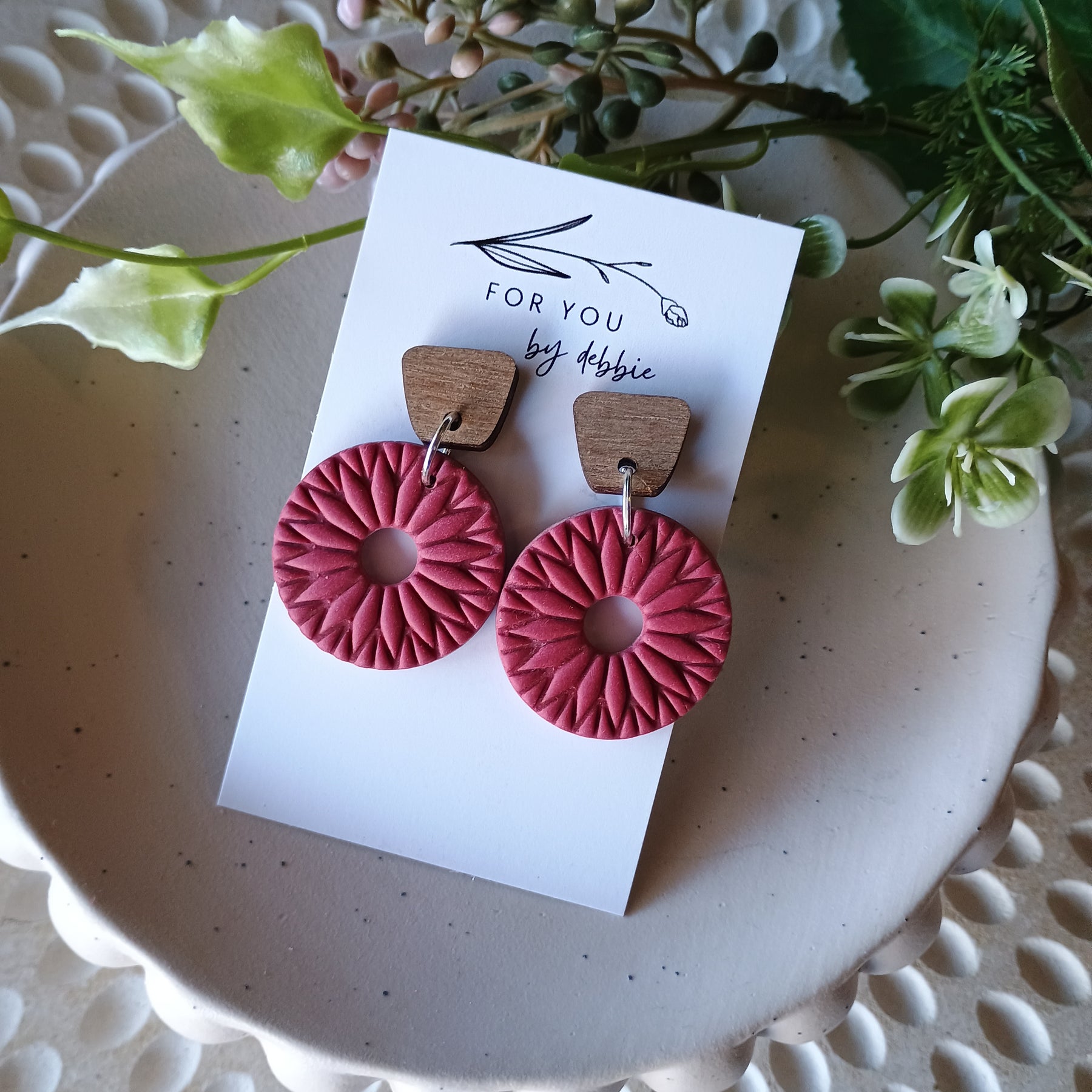 Red embossed circle earrings with natural wood stud