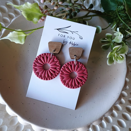 Red embossed circle earrings with natural wood stud
