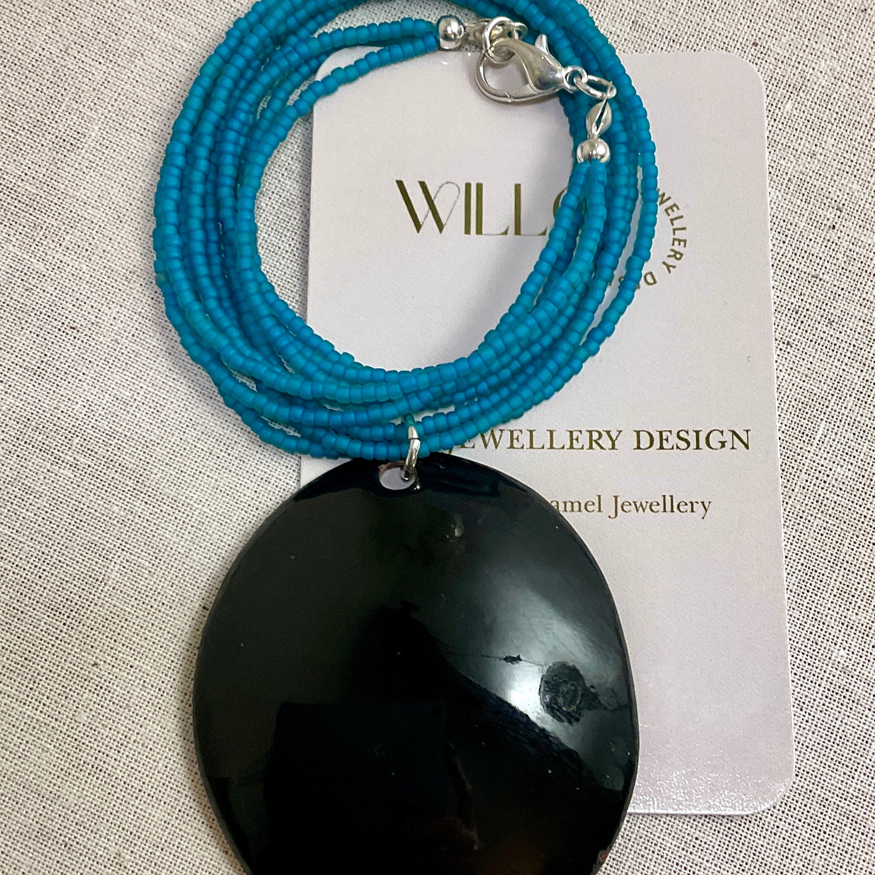 Turquoise pendant. Enamel and seed beads.