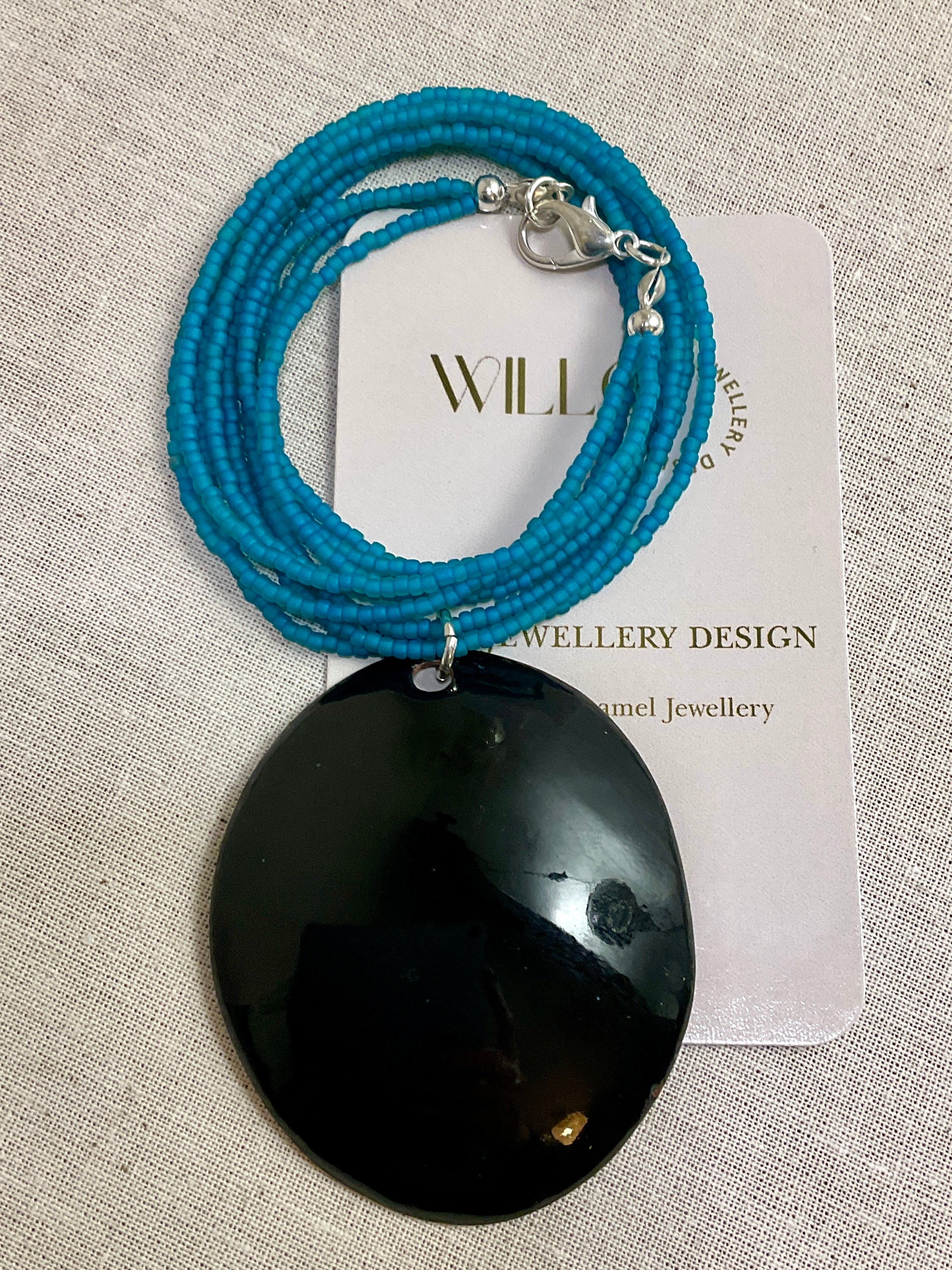 Turquoise pendant. Enamel and seed beads.