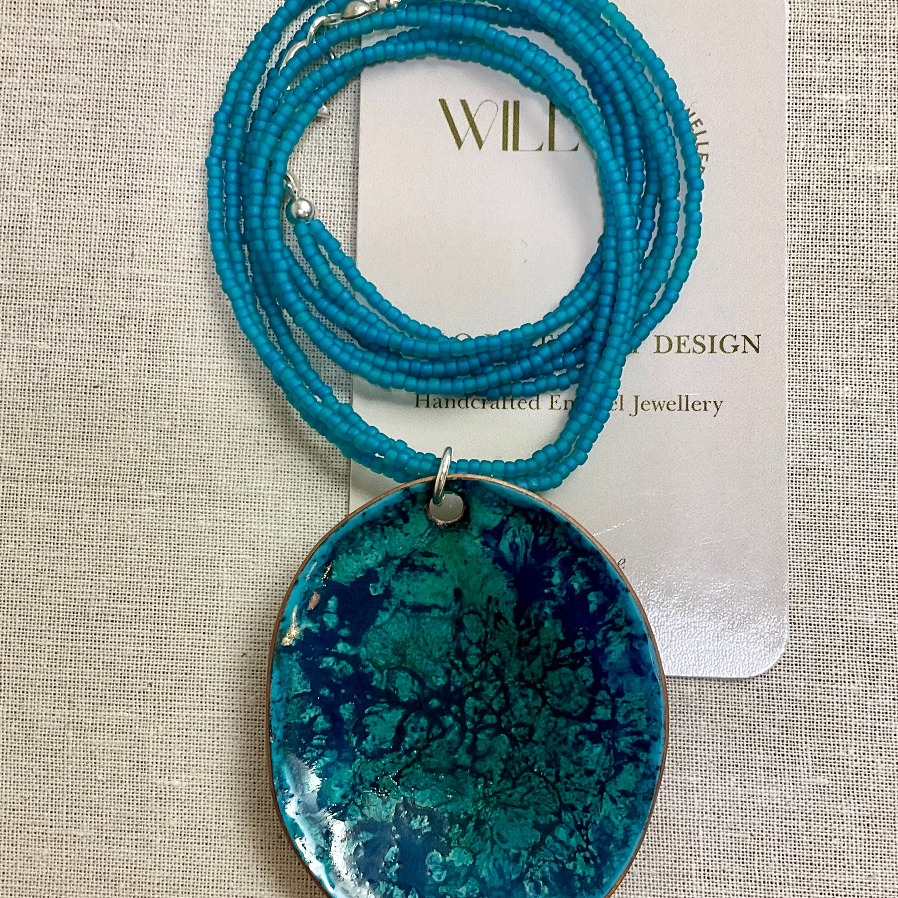 Turquoise pendant. Enamel and seed beads.