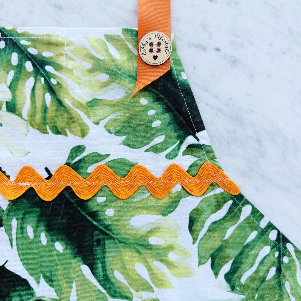 Tropical palm leaves pinafore ladies apron with pocket.