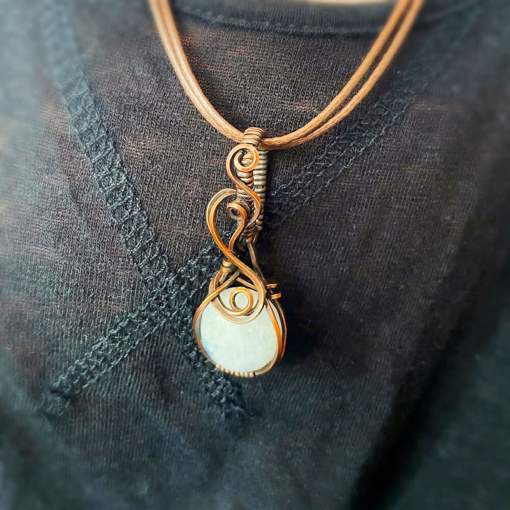 Captivating 47x17mm Wire-Wrapped Rainbow Moonstone Pendant