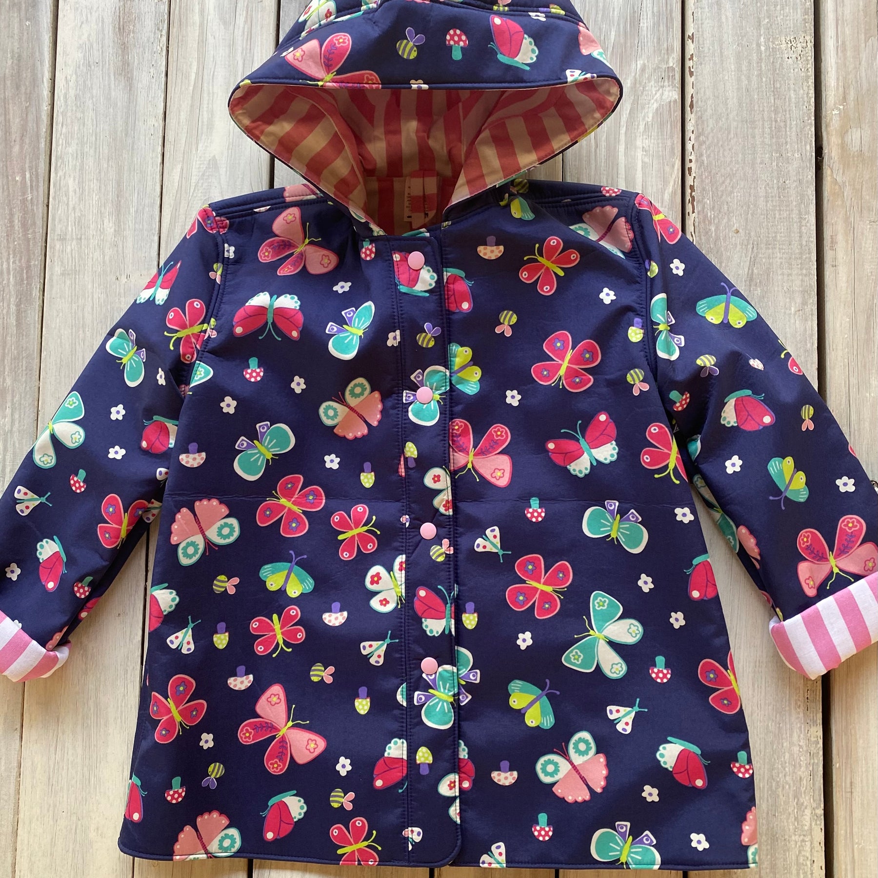 Showerproof Butterflies on Blue Hooded Jacket size 5