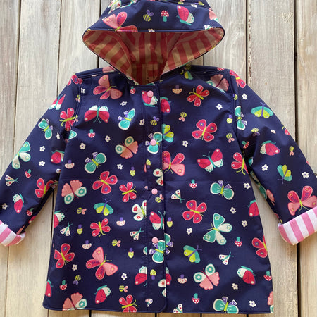 Showerproof Butterflies on Blue Hooded Jacket size 5