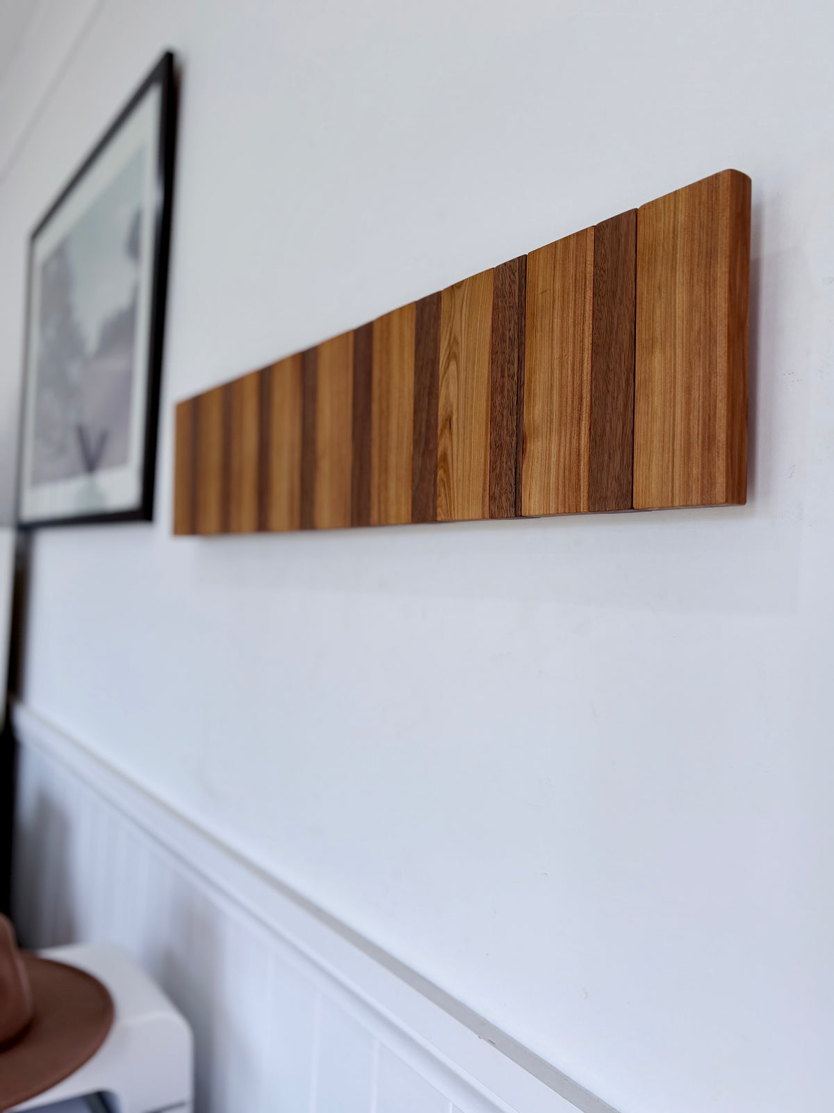 Two tone spotted gum and cypress horizon line piano style coatrack